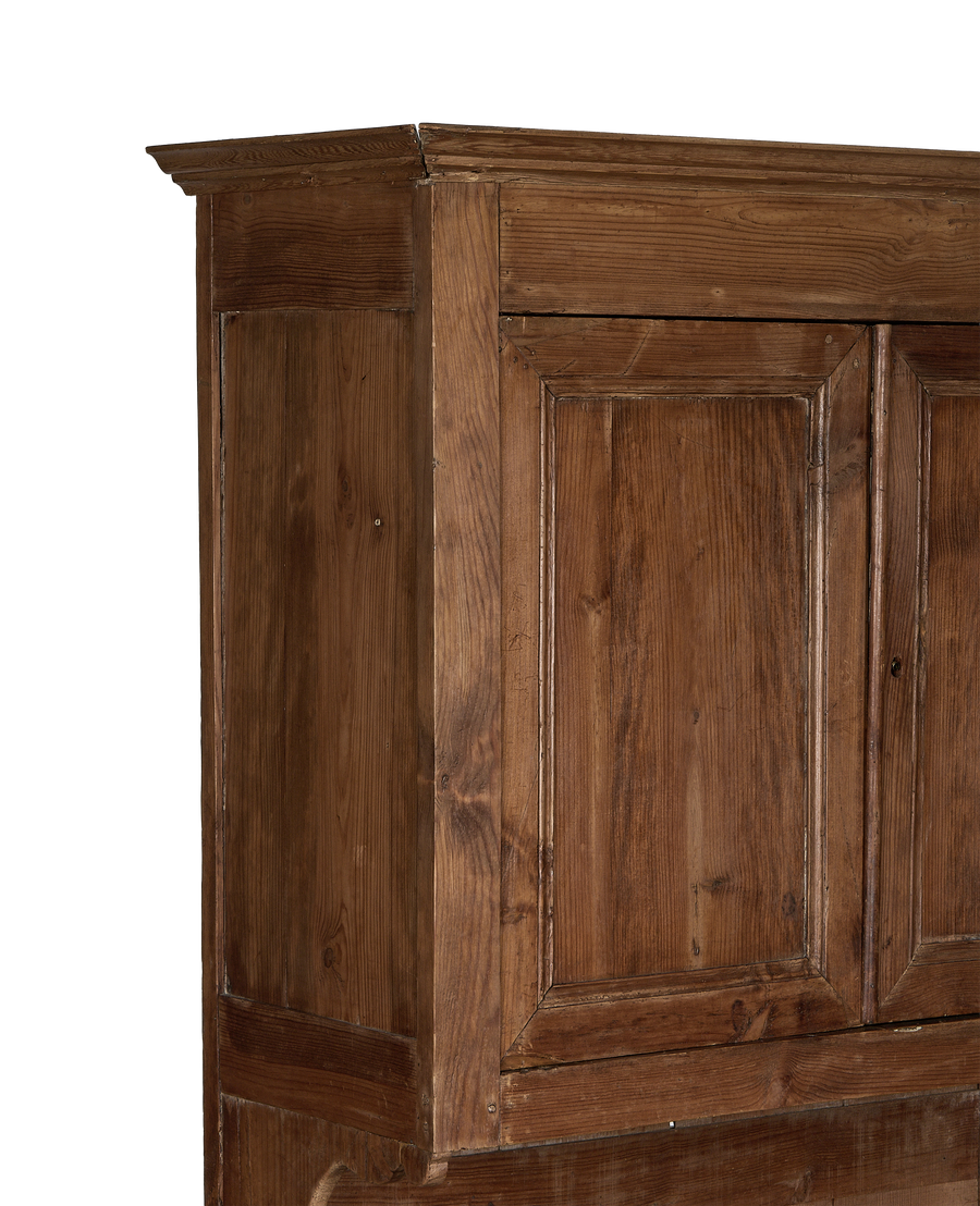 Vintage French oak baker's cabinet top, showing distressed wood grain and molding detail.