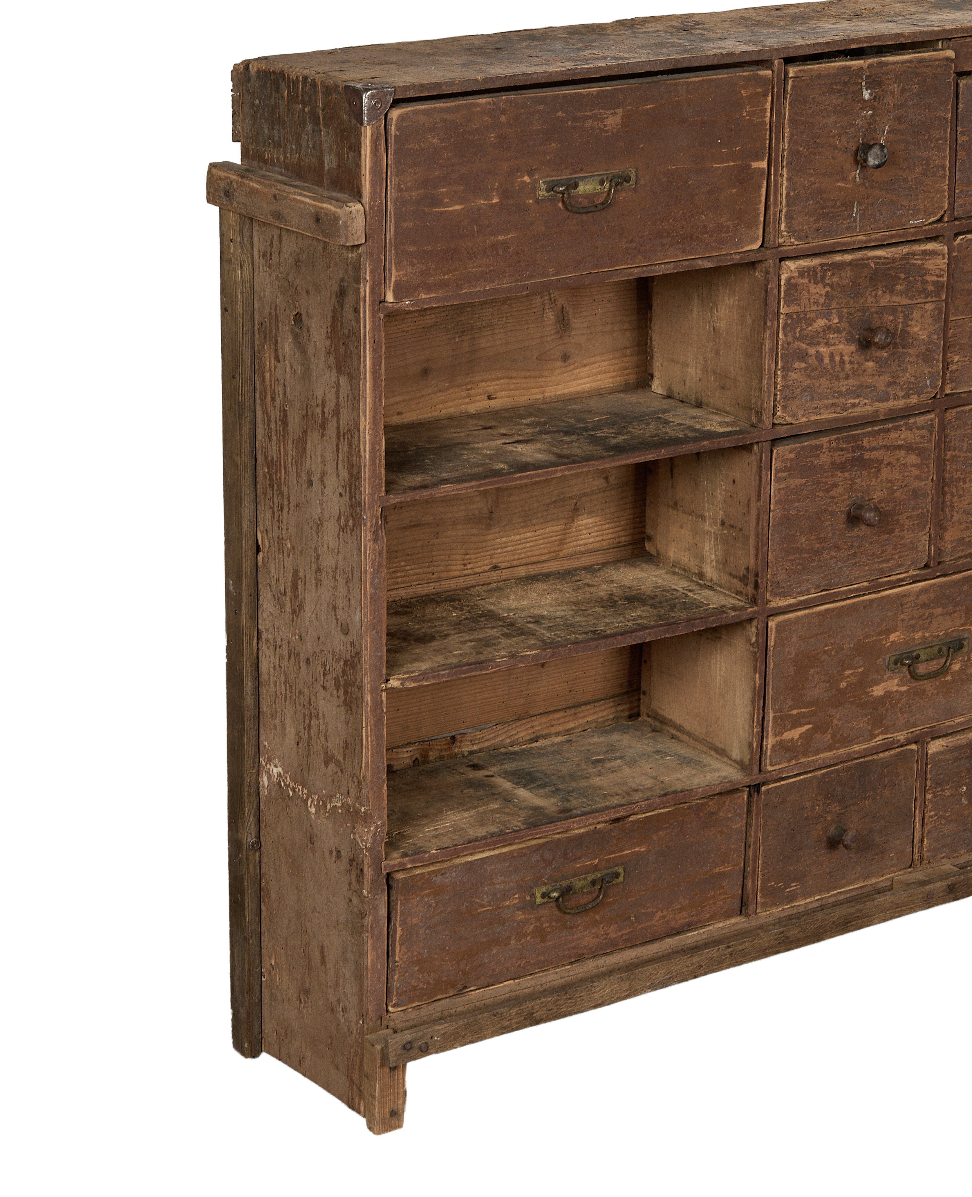 Vintage French oak apothecary sideboard with a side view of open shelves and drawers.