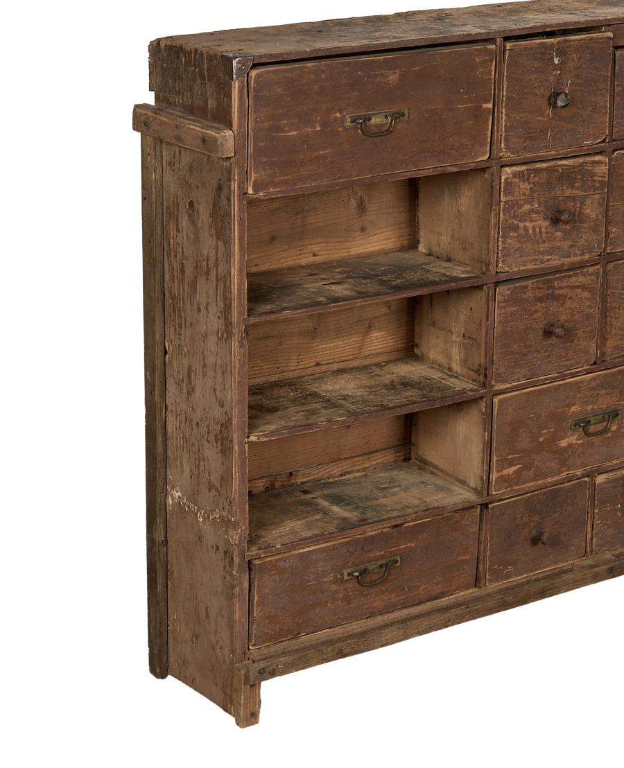 Vintage French oak apothecary sideboard with a side view of open shelves and drawers.