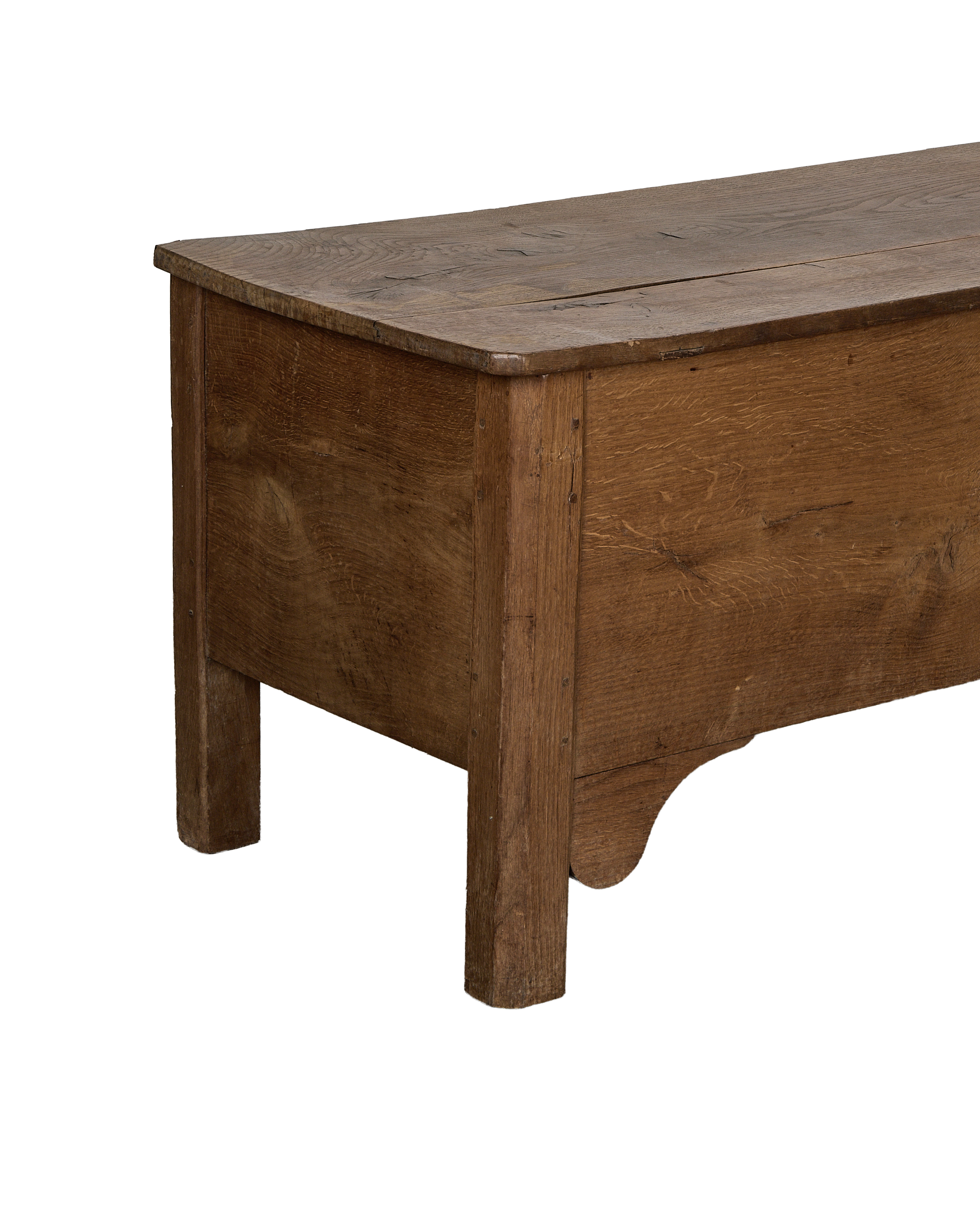 Vintage French oak storage trunk, close-up of aged wood grain and detailed side panel.