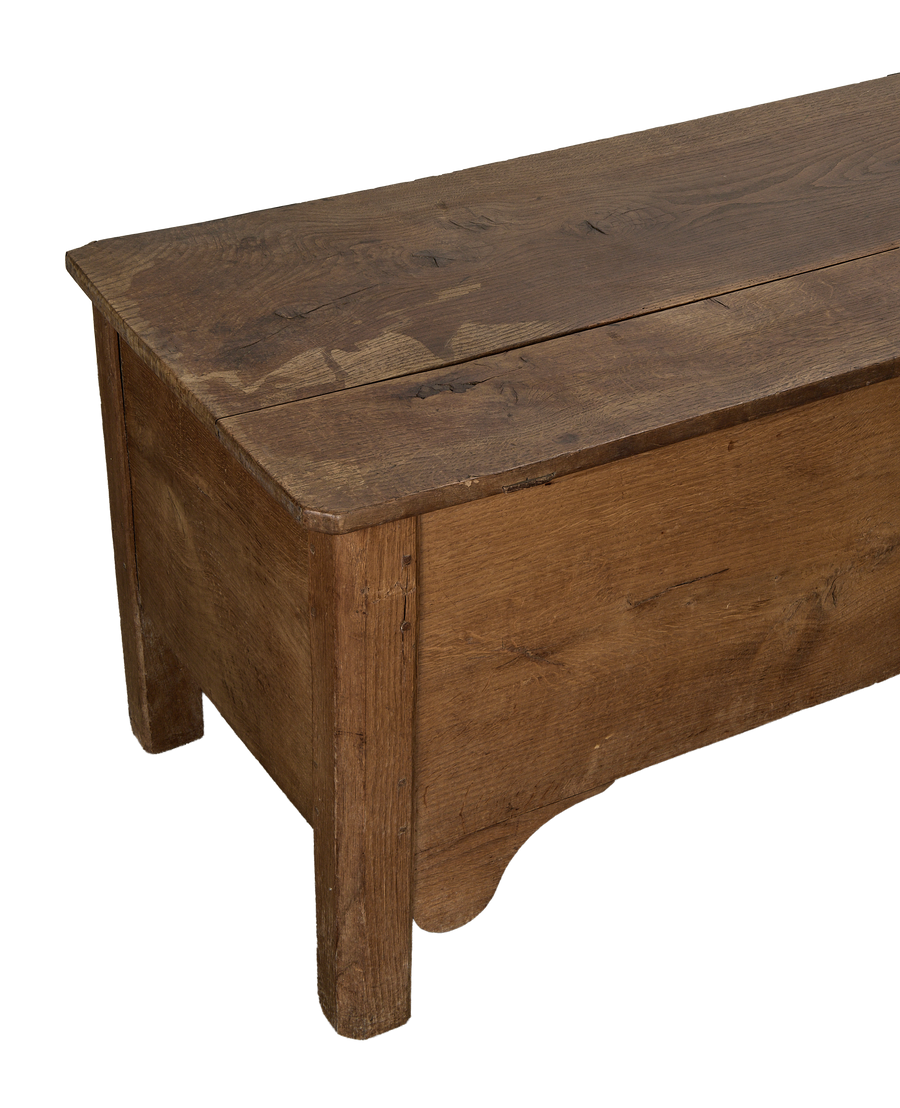 Vintage French oak storage trunk, unique side detailing, aged rustic wood finish.