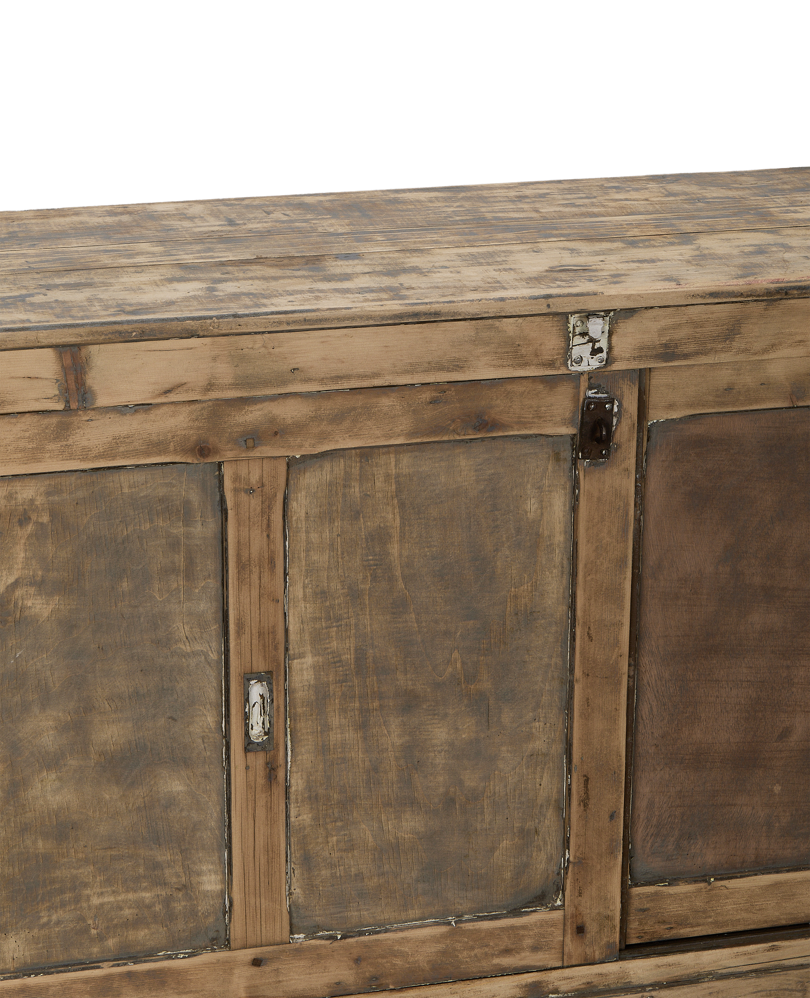 Close-up of vintage French oak sideboard showing distressed paint, hardware, and wood grain.