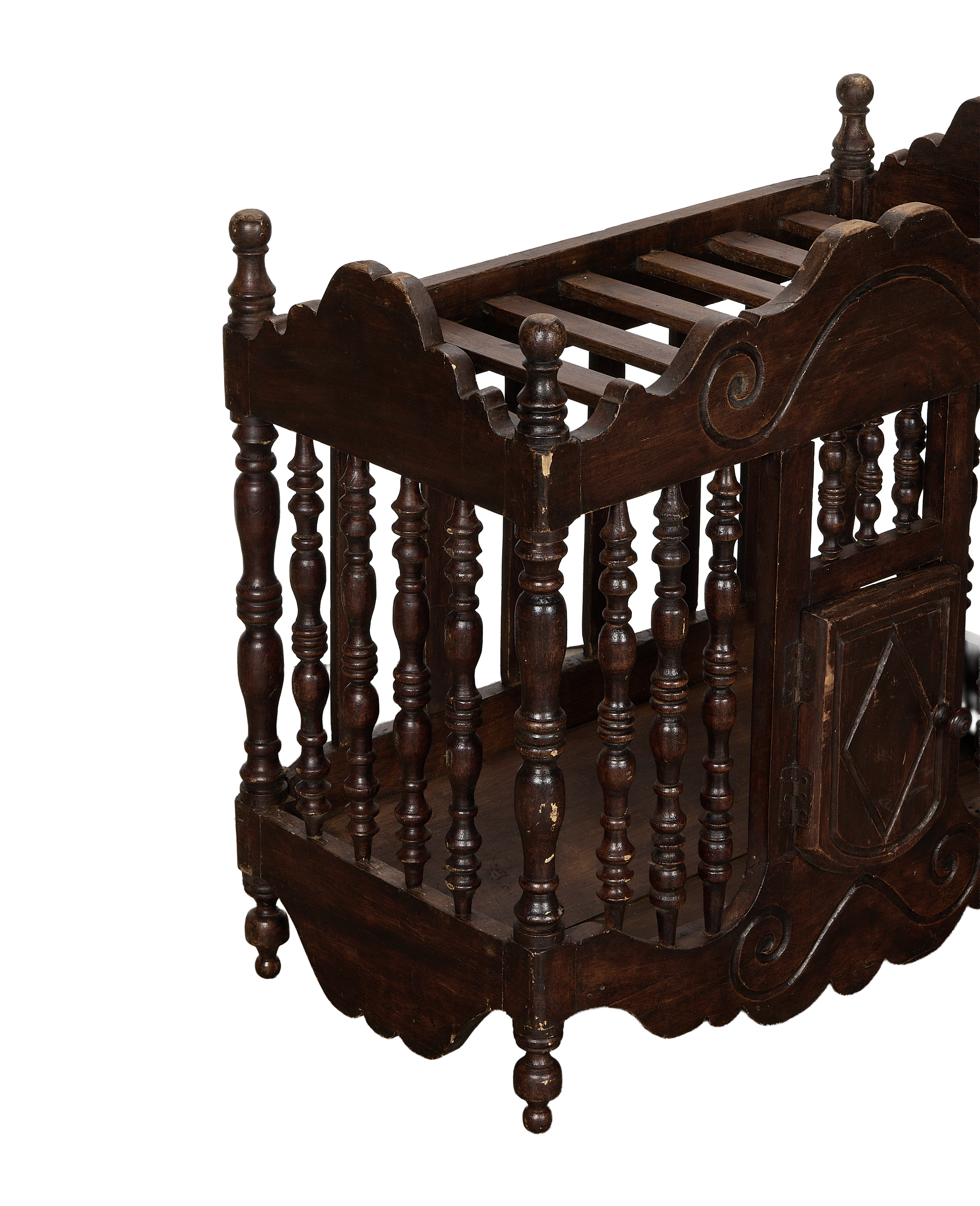 Vintage French oak bread cabinet, showing turned spindles, carved details, and distressed dark finish.
