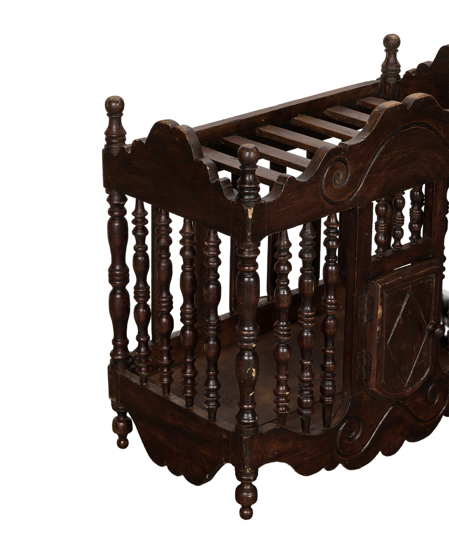 Vintage French oak bread cabinet, showing turned spindles, carved details, and distressed dark finish.