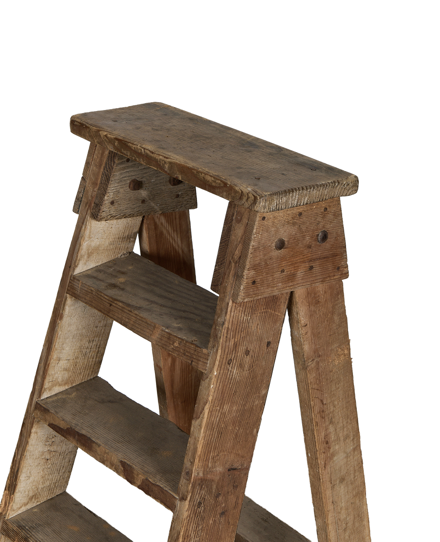 Vintage French wood shop ladder, angled top view, showing textured steps and aged timber.
