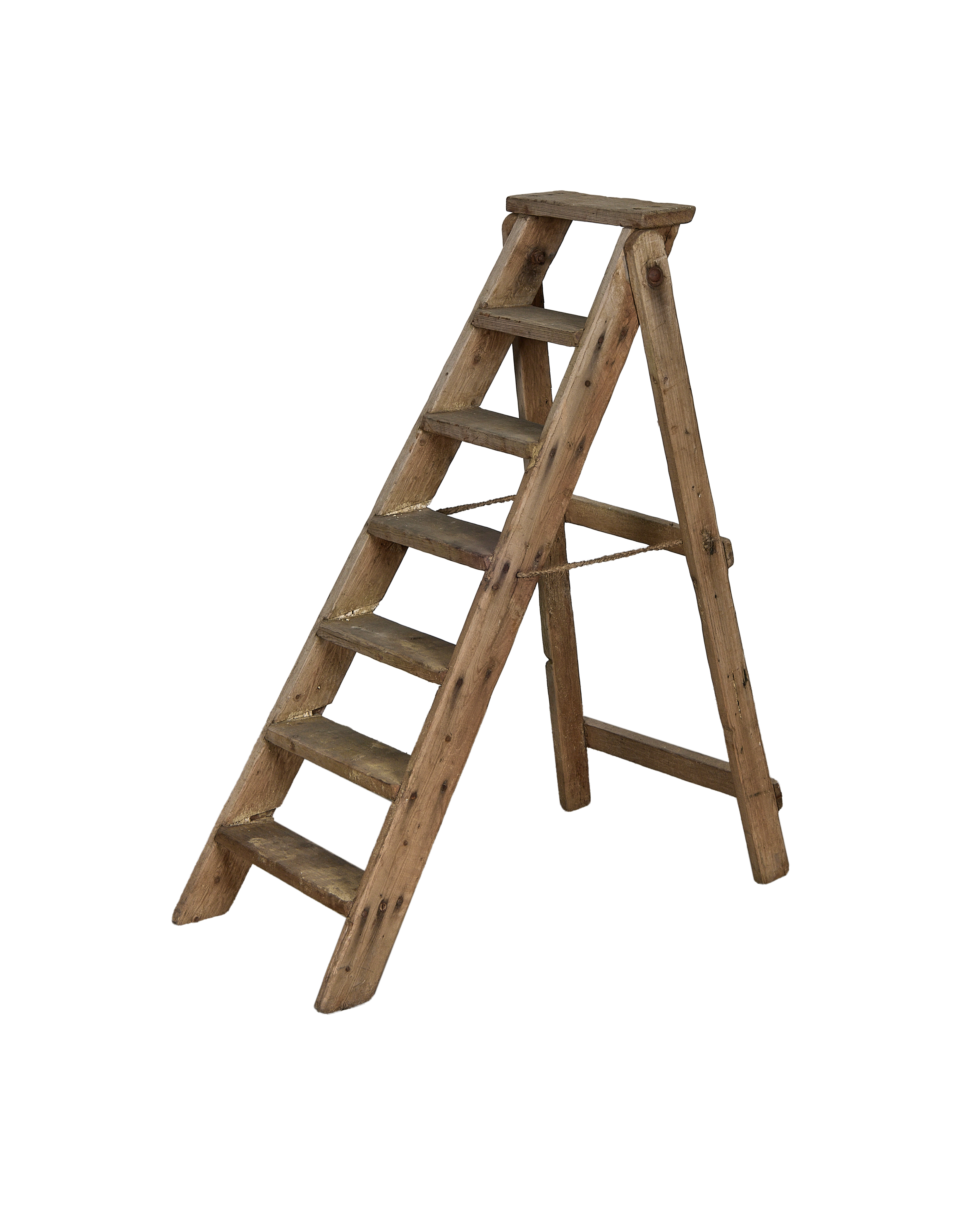 Vintage French wooden shop ladder, side view, showing weathered surface and rope safety chain.