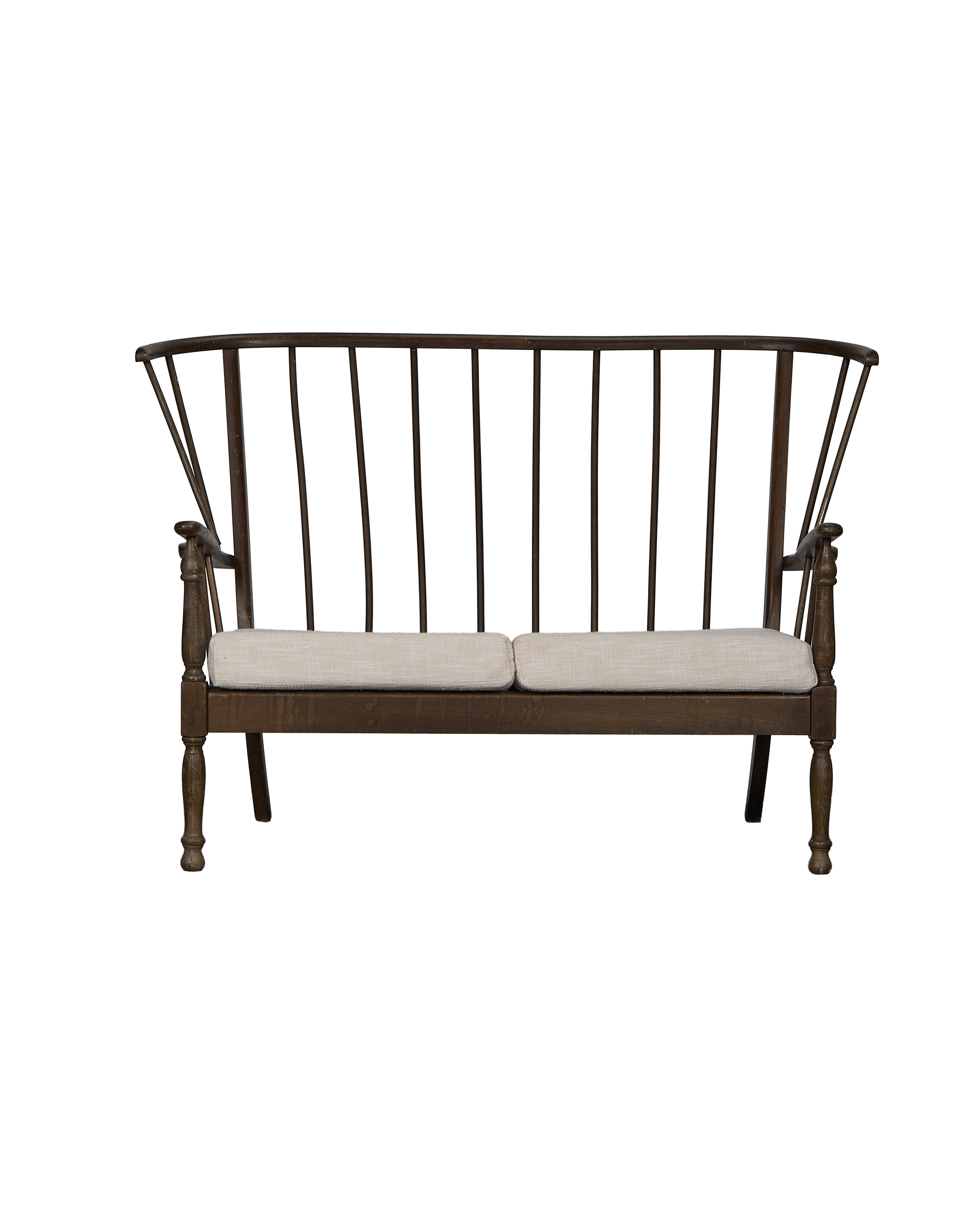 Vintage French oak lounge bench, full front view, showing spindle back and light linen cushions.
