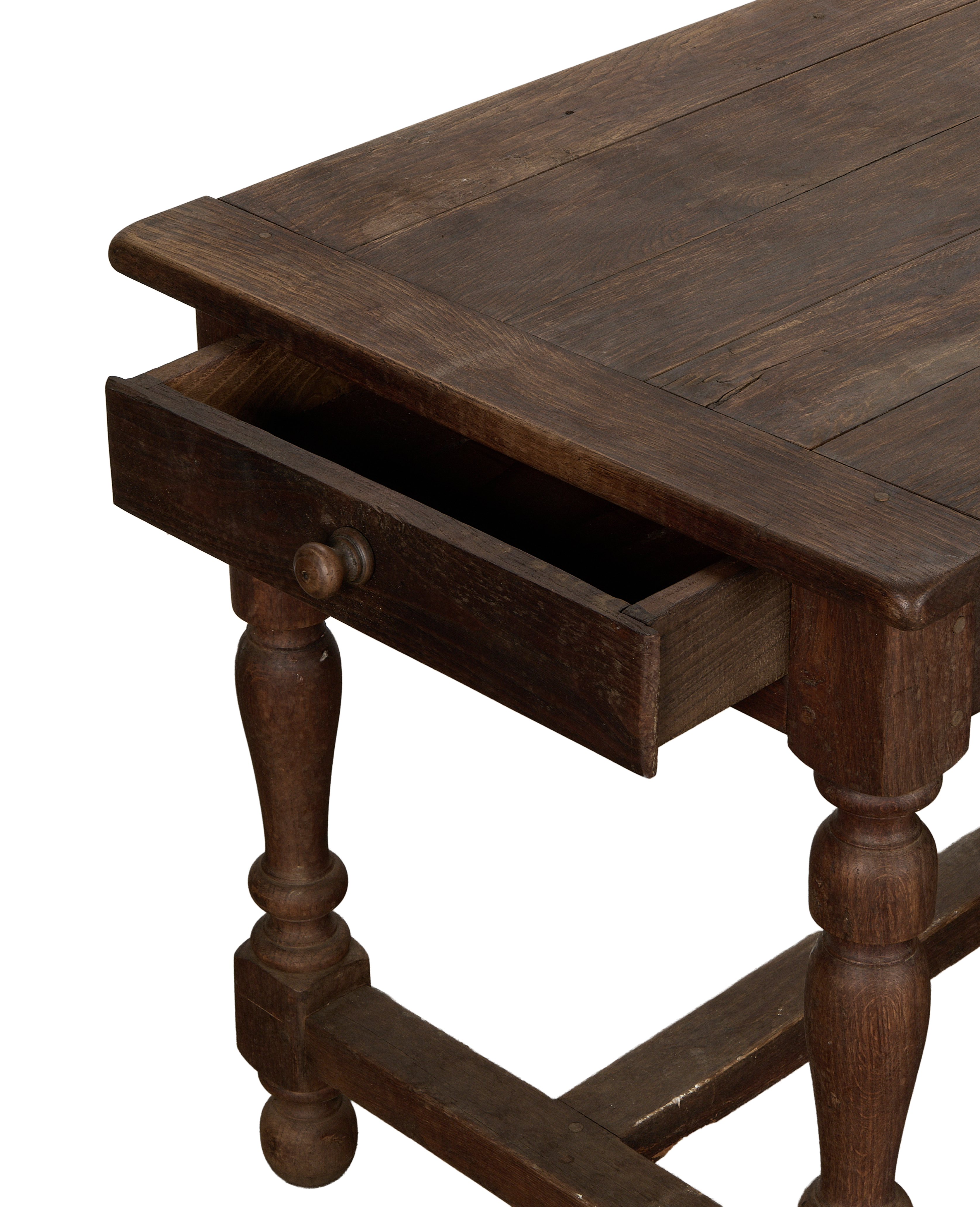 Vintage French oak draper's table with a partially open drawer showing its interior.