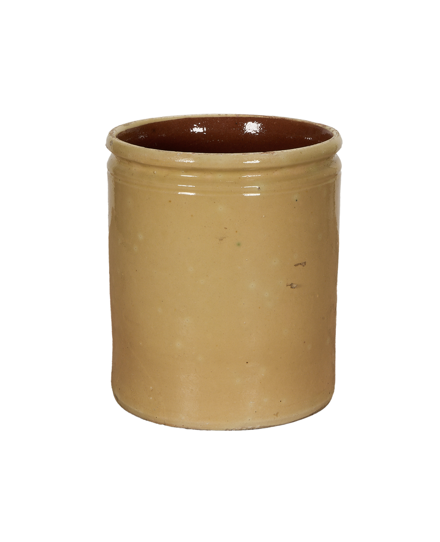 Antique French stoneware confit pot with mustard yellow glaze, close-up of rim interior.