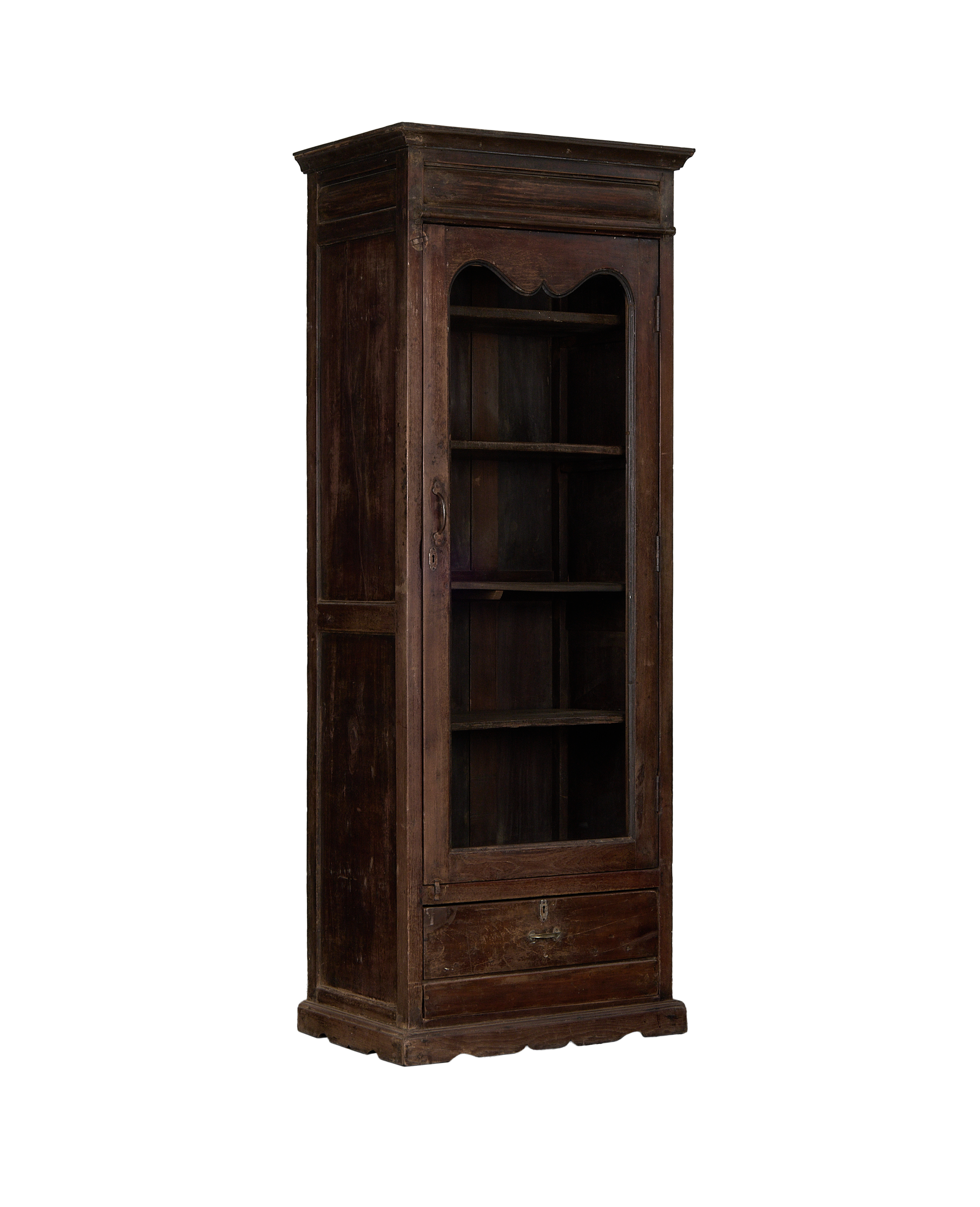 Vintage Indian oak cabinet, full frontal view, showing glass door, empty shelves, and bottom drawer.