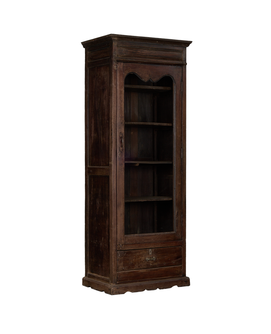 Vintage Indian oak cabinet, full frontal view, showing glass door, empty shelves, and bottom drawer.