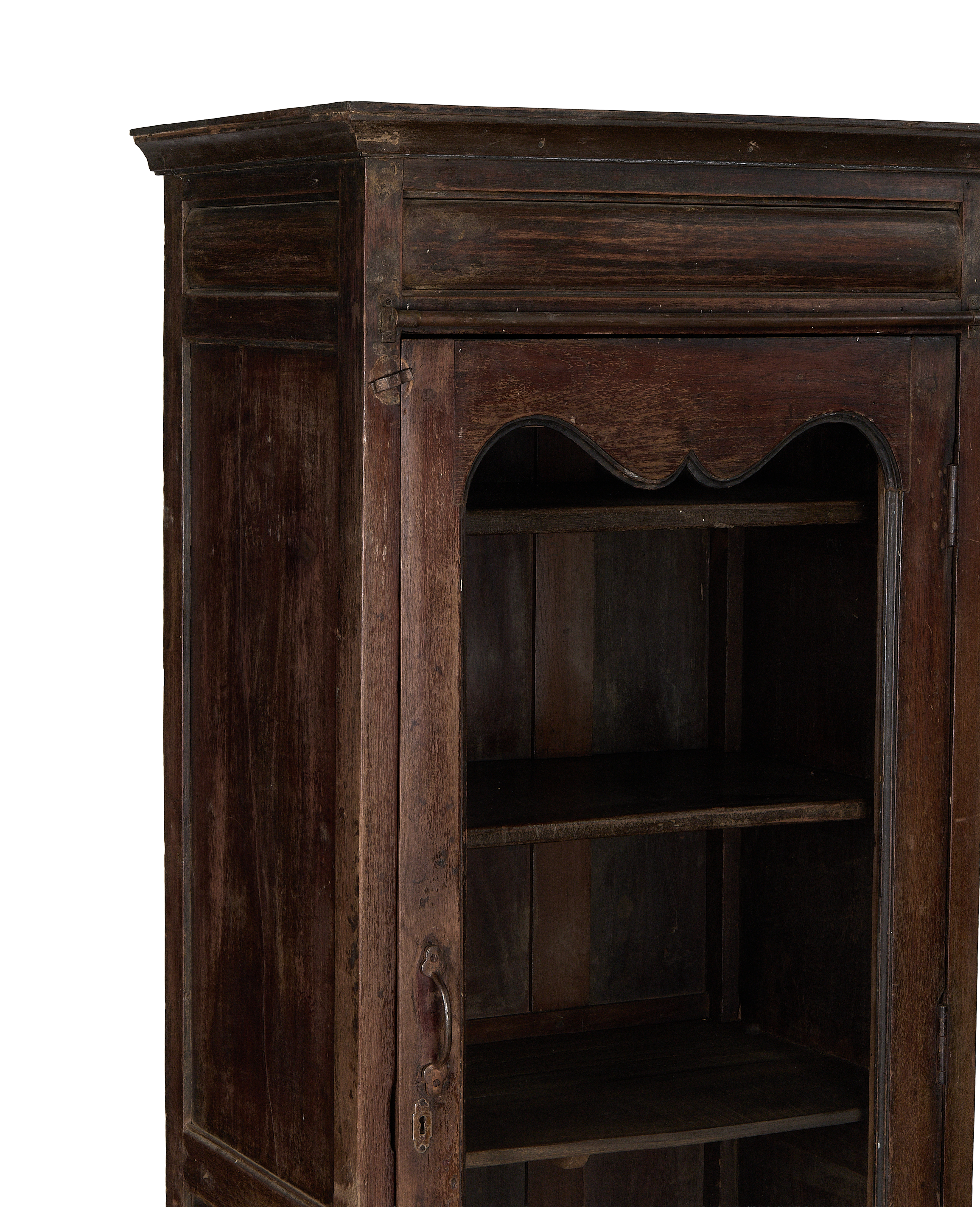 Vintage Indian oak cabinet, open door revealing interior shelves and period handle.