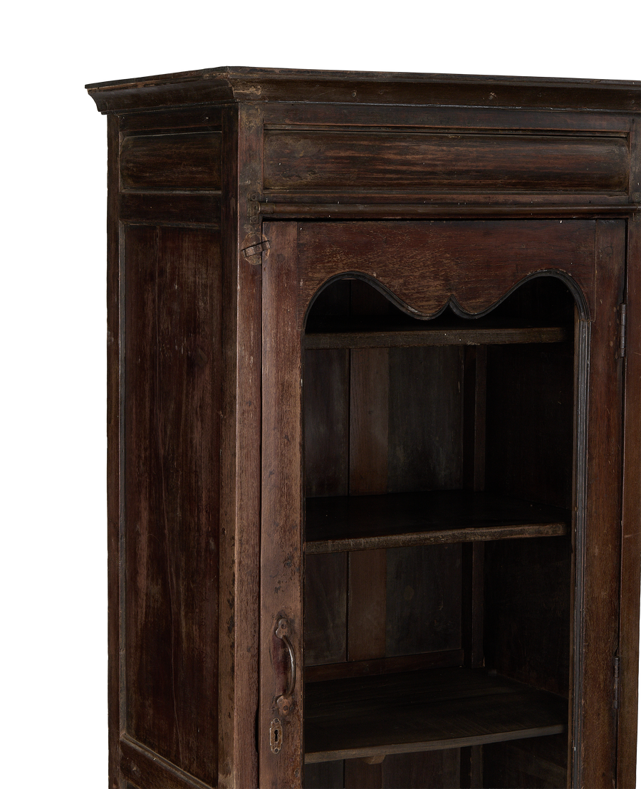 Vintage Indian oak cabinet, open door revealing interior shelves and period handle.