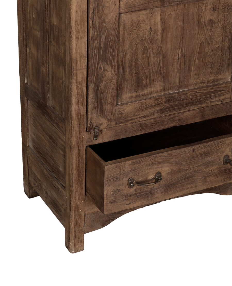 Vintage Indian oak cabinet: lower drawer with decorative metal pull, natural wood grain.