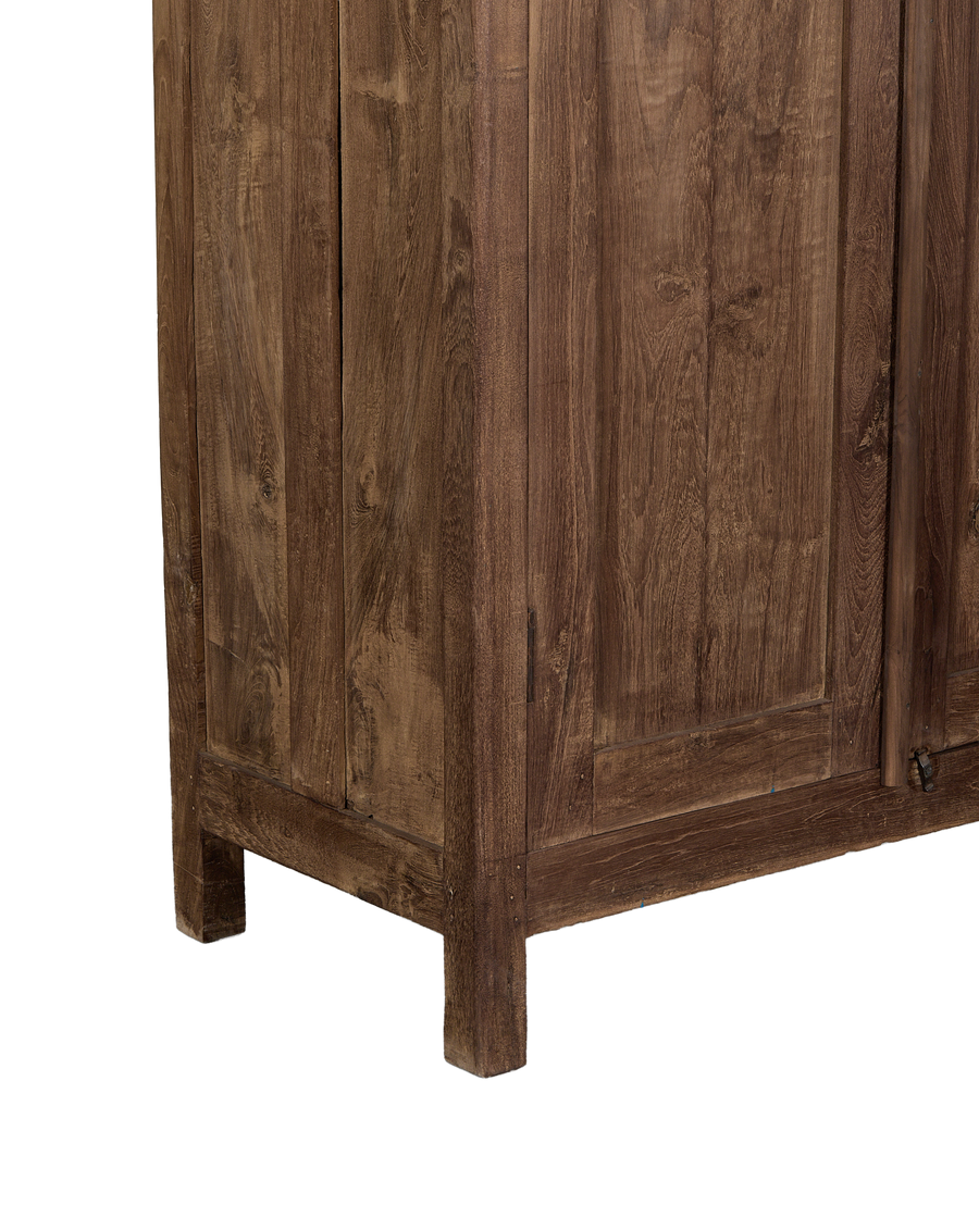 Close-up of the vintage Indian oak wood cabinet's natural grain and sturdy legs.