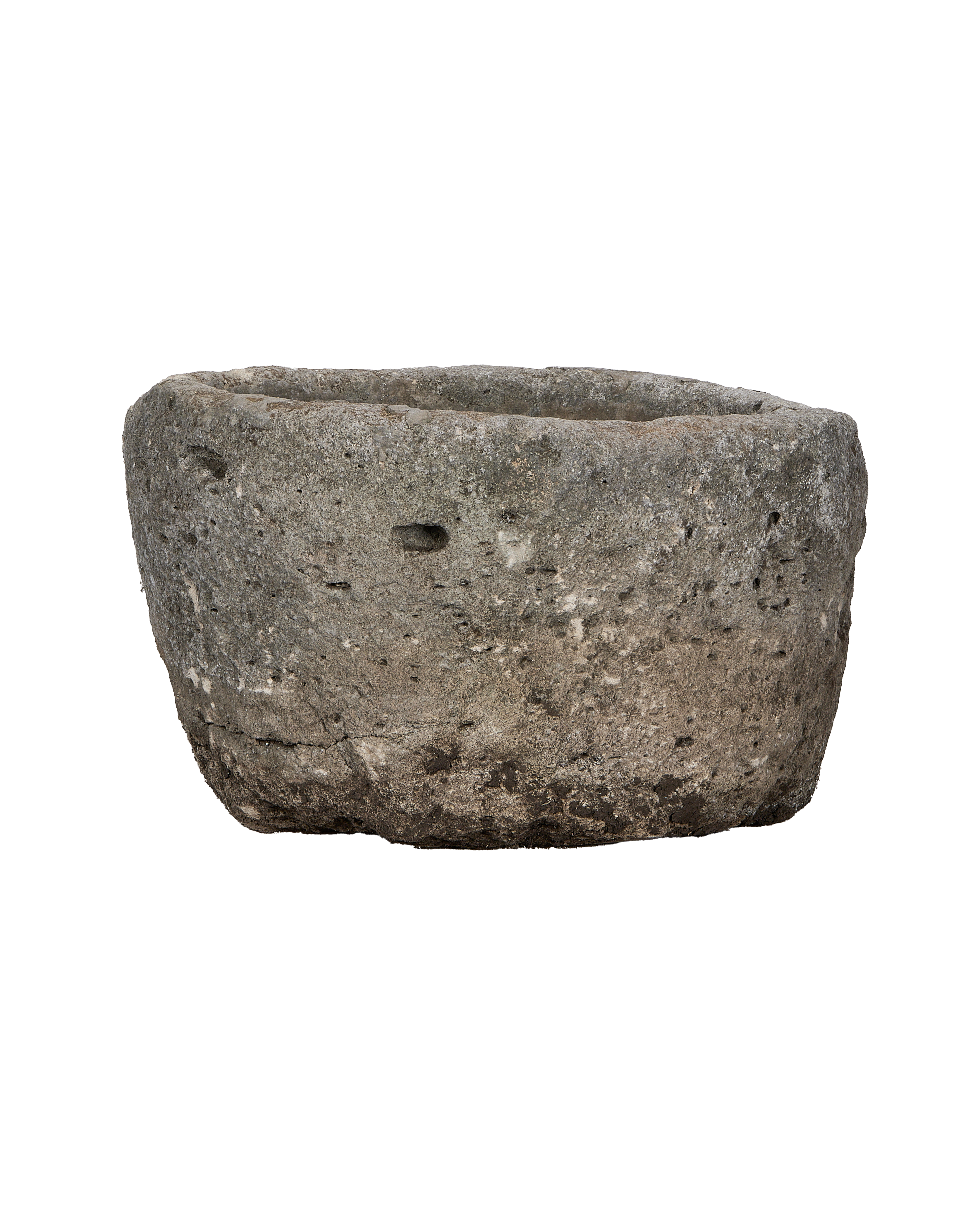 Vintage Indonesian round limestone trough, naturally weathered with textured surface on black.