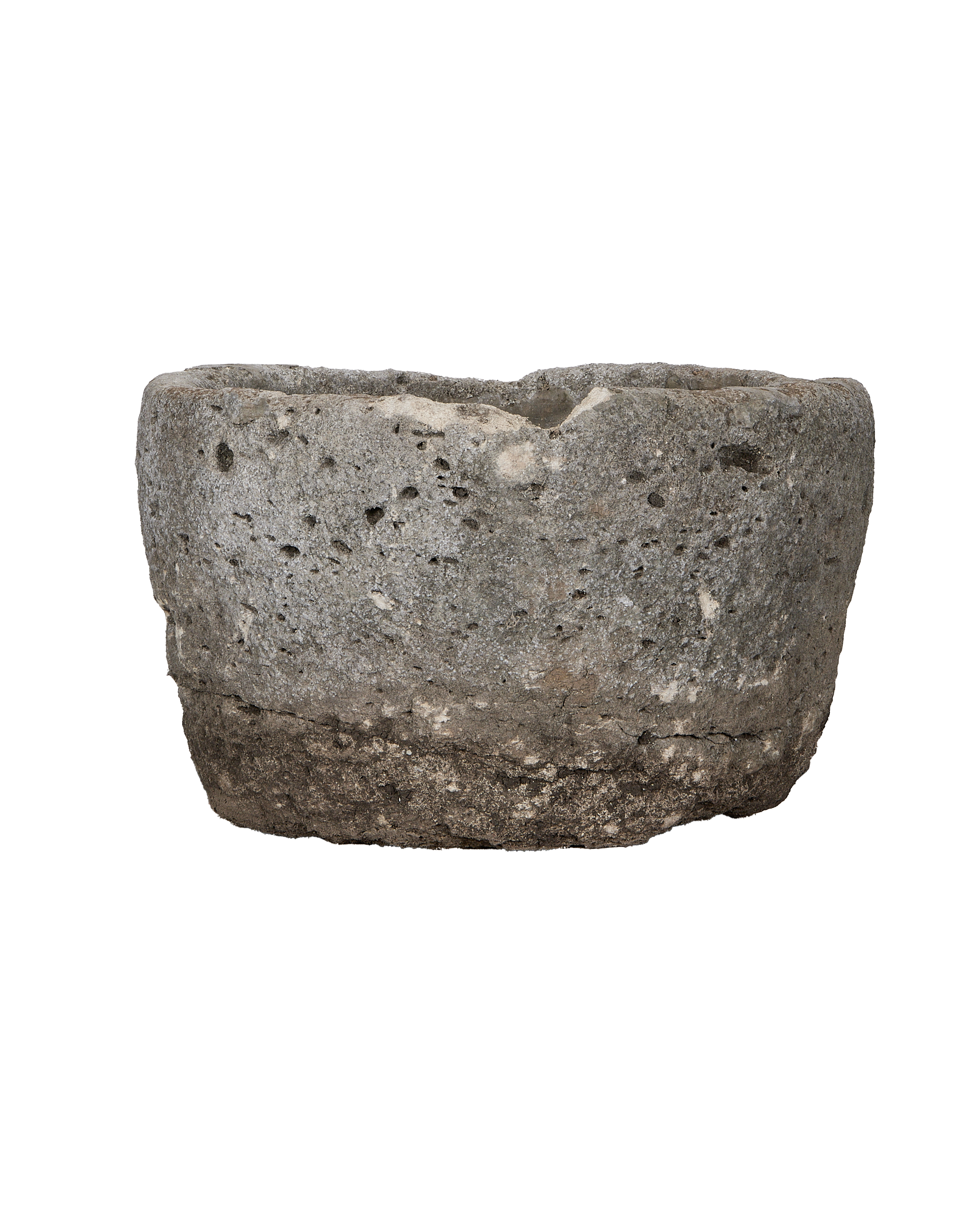 Vintage round limestone trough, side view revealing rough texture imperfections.