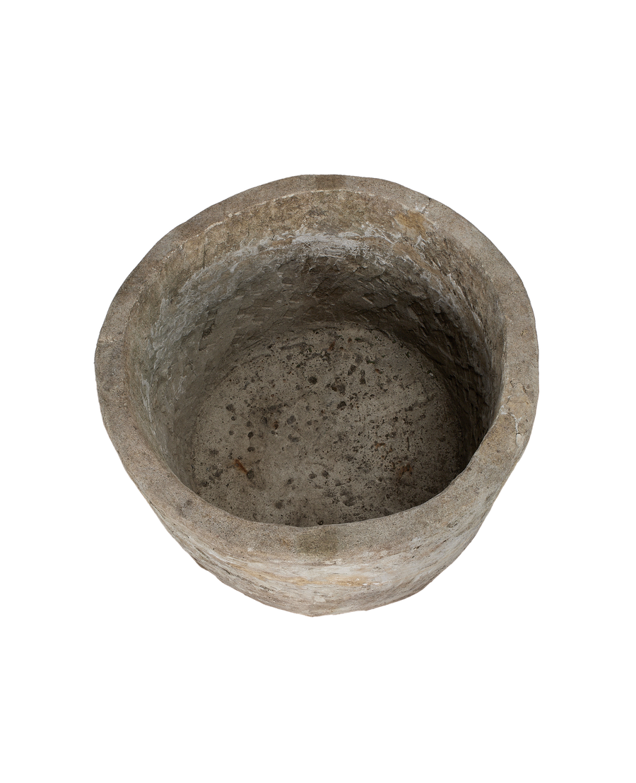 Vintage round Indonesian limestone trough, top-down view showing interior texture.