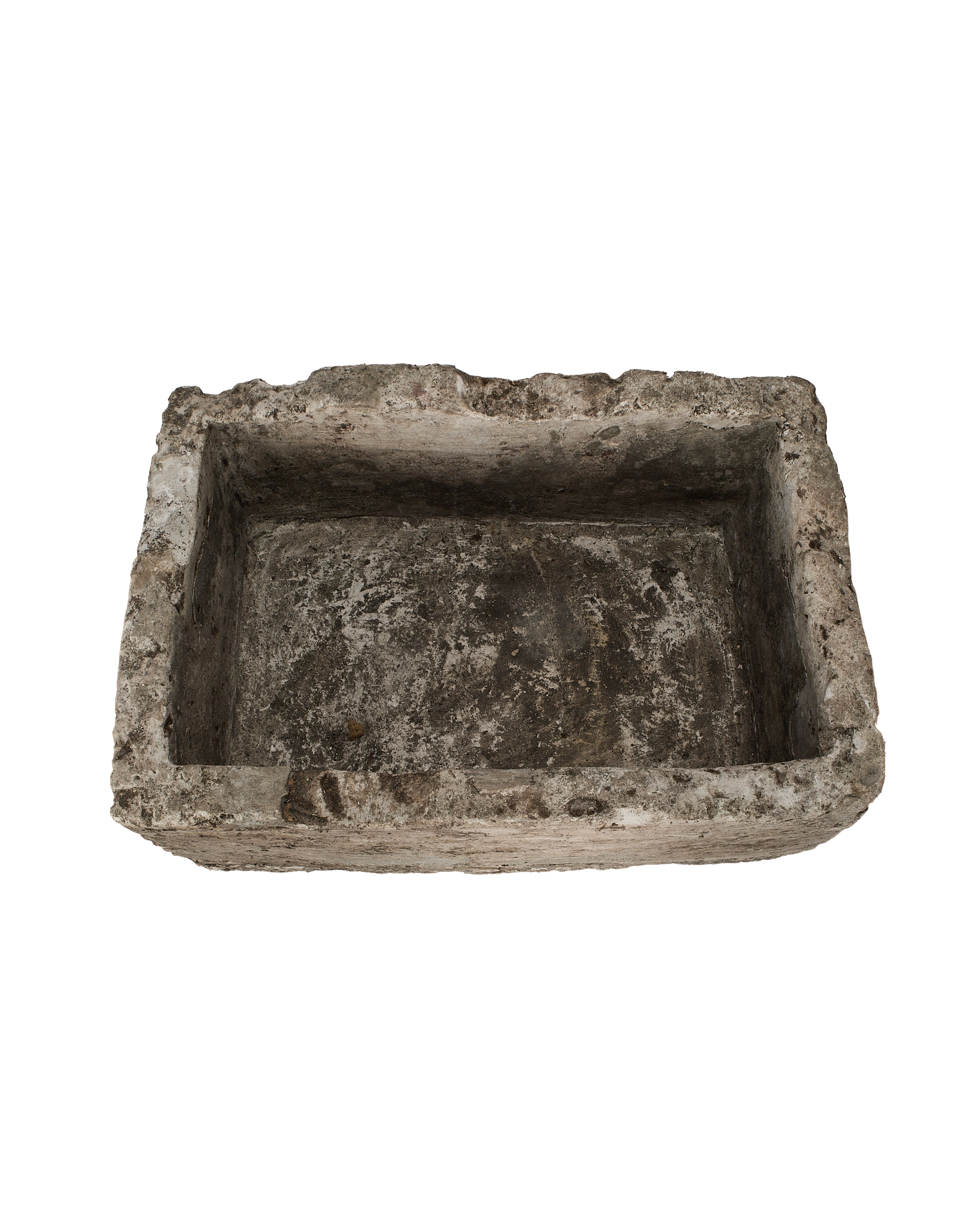 Vintage rectangular limestone trough, distressed texture, from above, showcasing rough interior and edges.