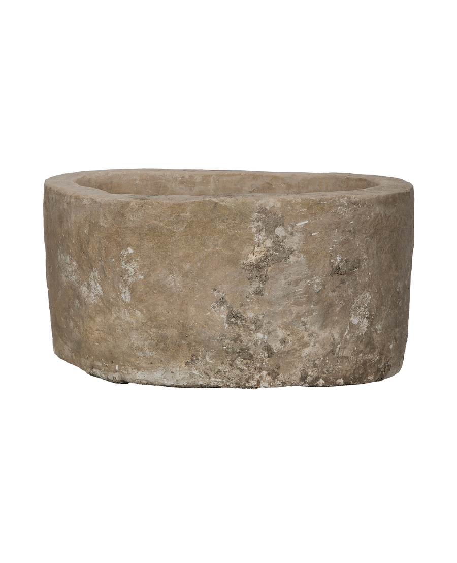 Vintage oblong Indonesian limestone trough, showing weathered texture and natural imperfections from above.