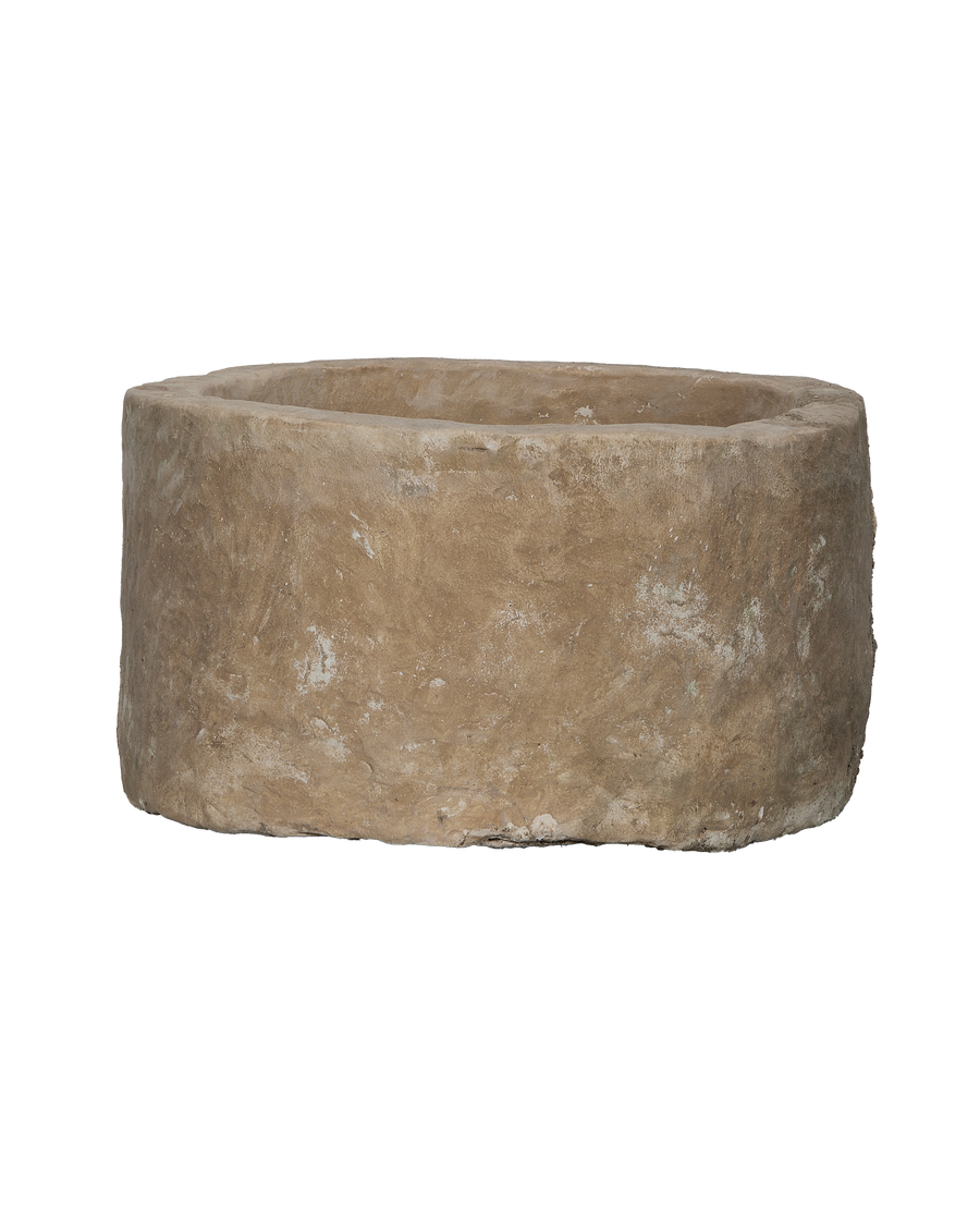 Vintage oblong limestone trough from Indonesia, showing its weathered and textured exterior.