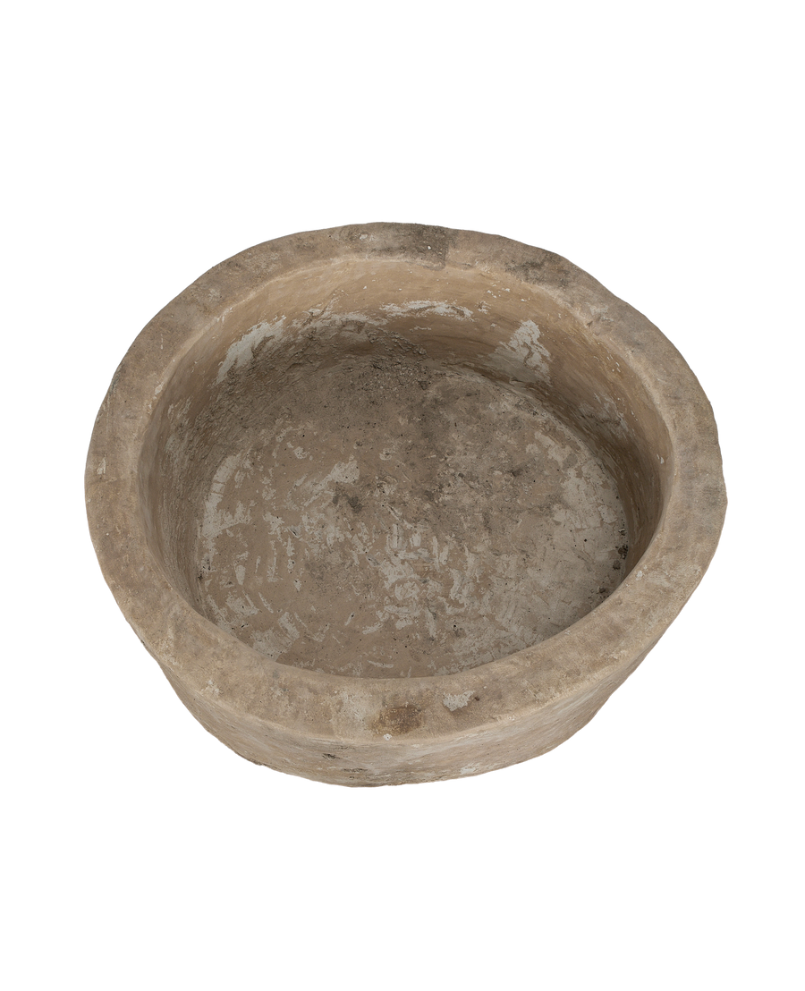 Vintage Indonesian limestone trough (OAK), close-up top view showing weathered oblong interior.