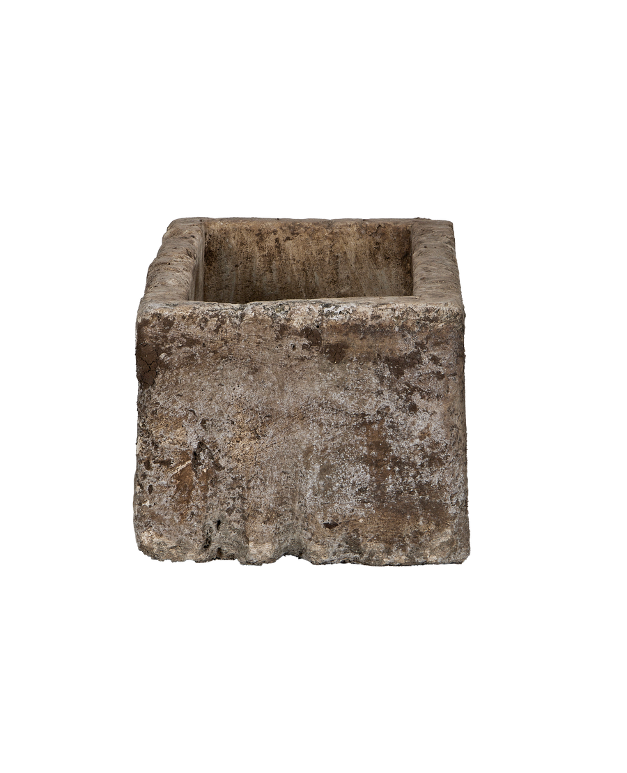 Vintage Indonesian rectangle limestone trough, showing distressed, weathered sides and rugged texture.