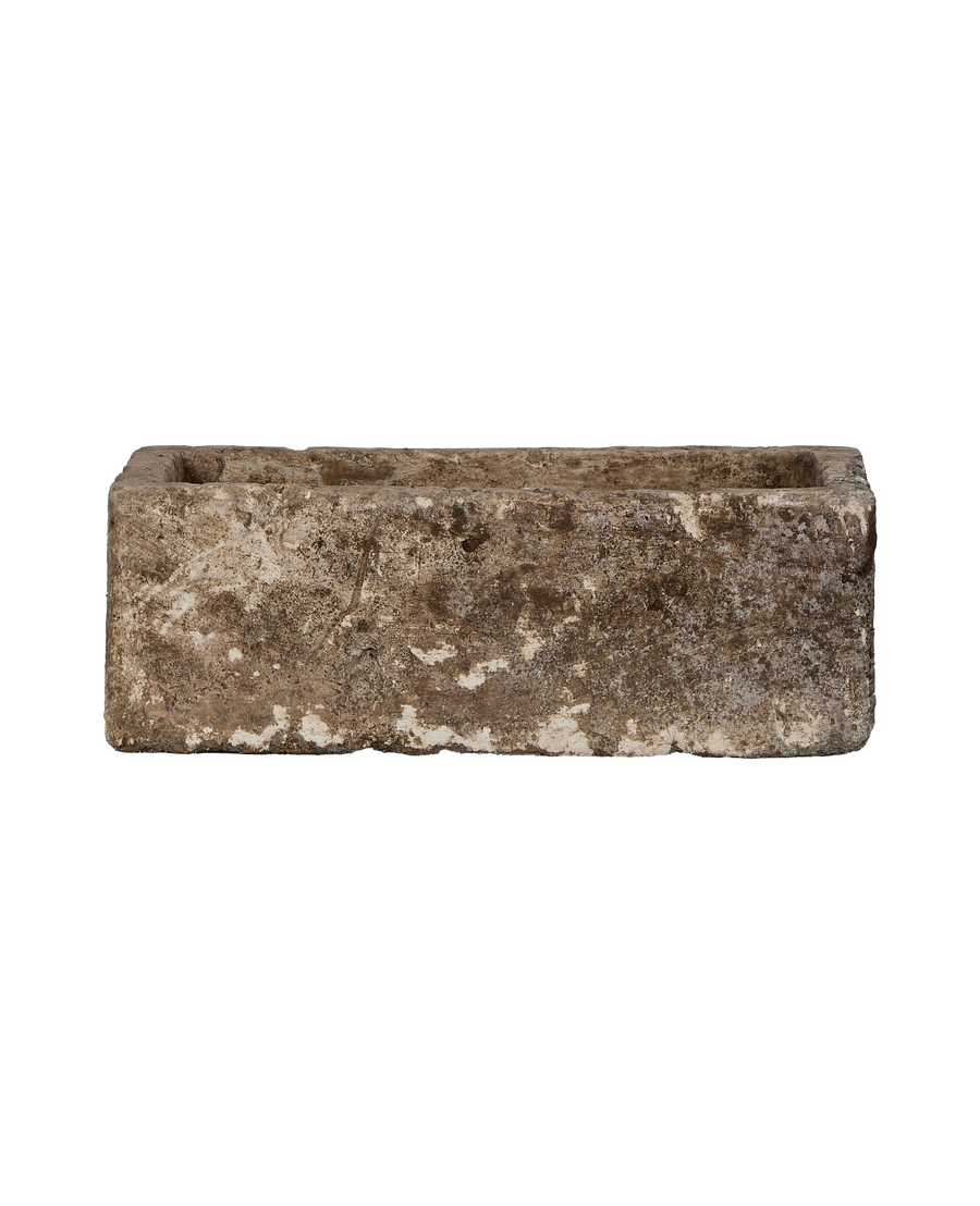 Vintage Indonesian rectangular limestone trough planter, showing rough weathered texture.