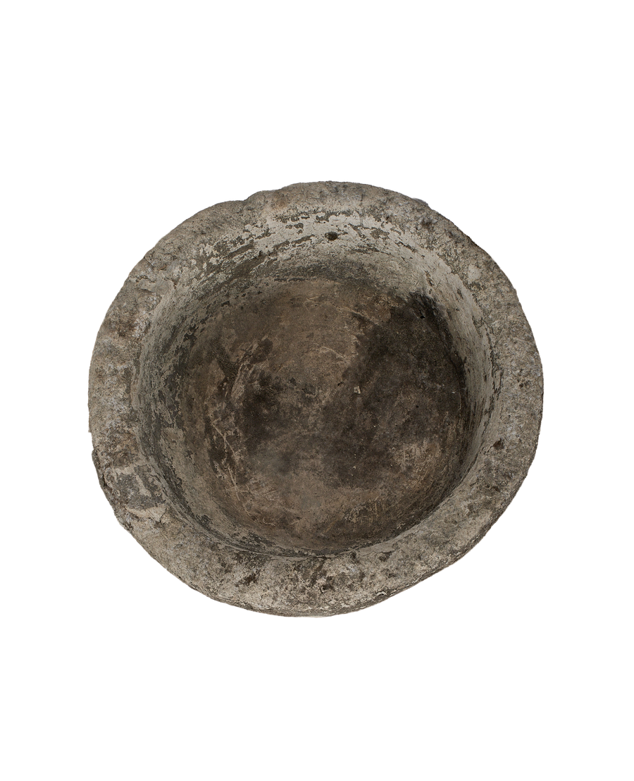 Vintage Indonesian round limestone trough, top-down view showing weathered, textured interior patina.