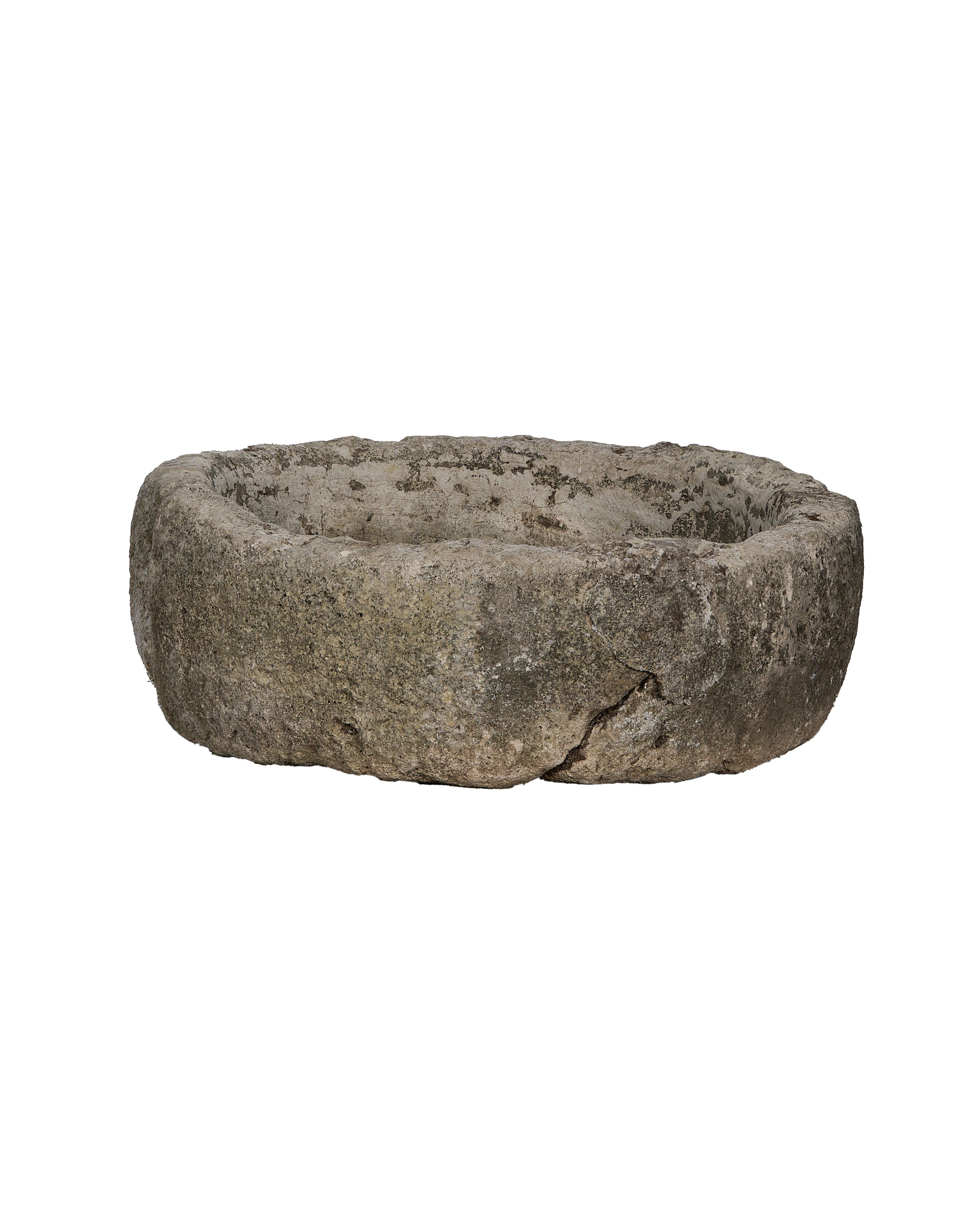 Vintage Indonesian limestone trough, round, showing detailed weathered texture and a prominent crack in full view.