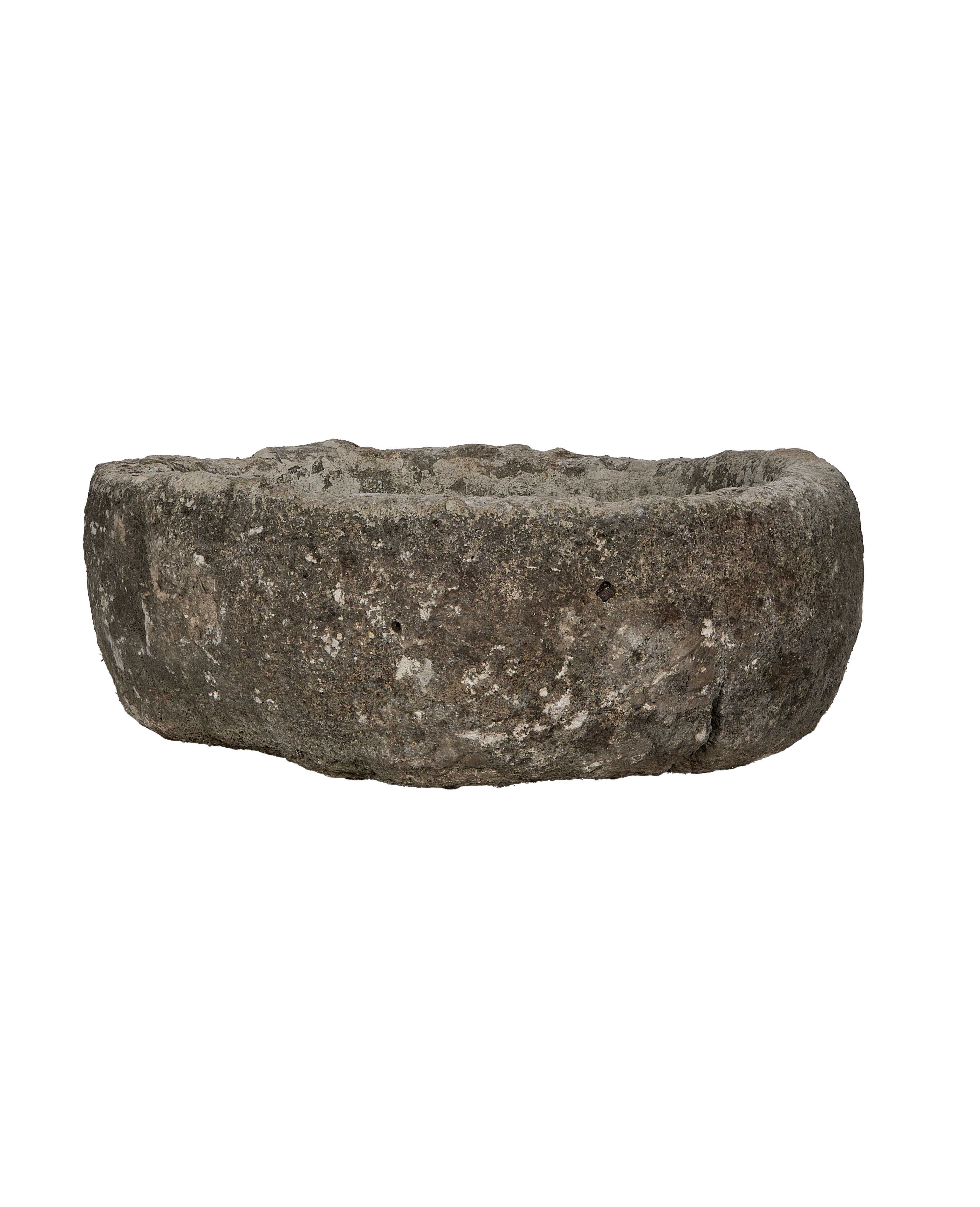 Vintage round limestone trough, side profile, raw texture, showing weathered condition and shallow interior.