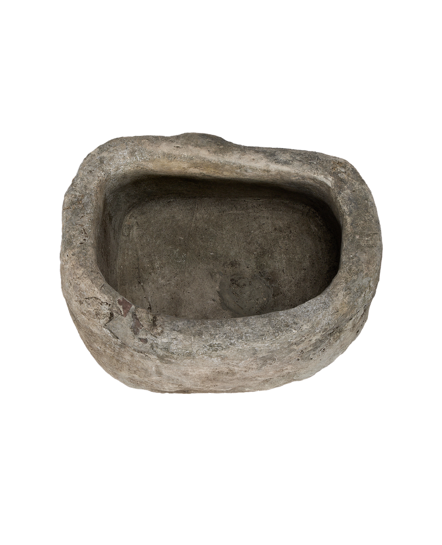 Vintage Indonesian limestone trough, top-down view highlighting the weathered oblong basin and unique texture.