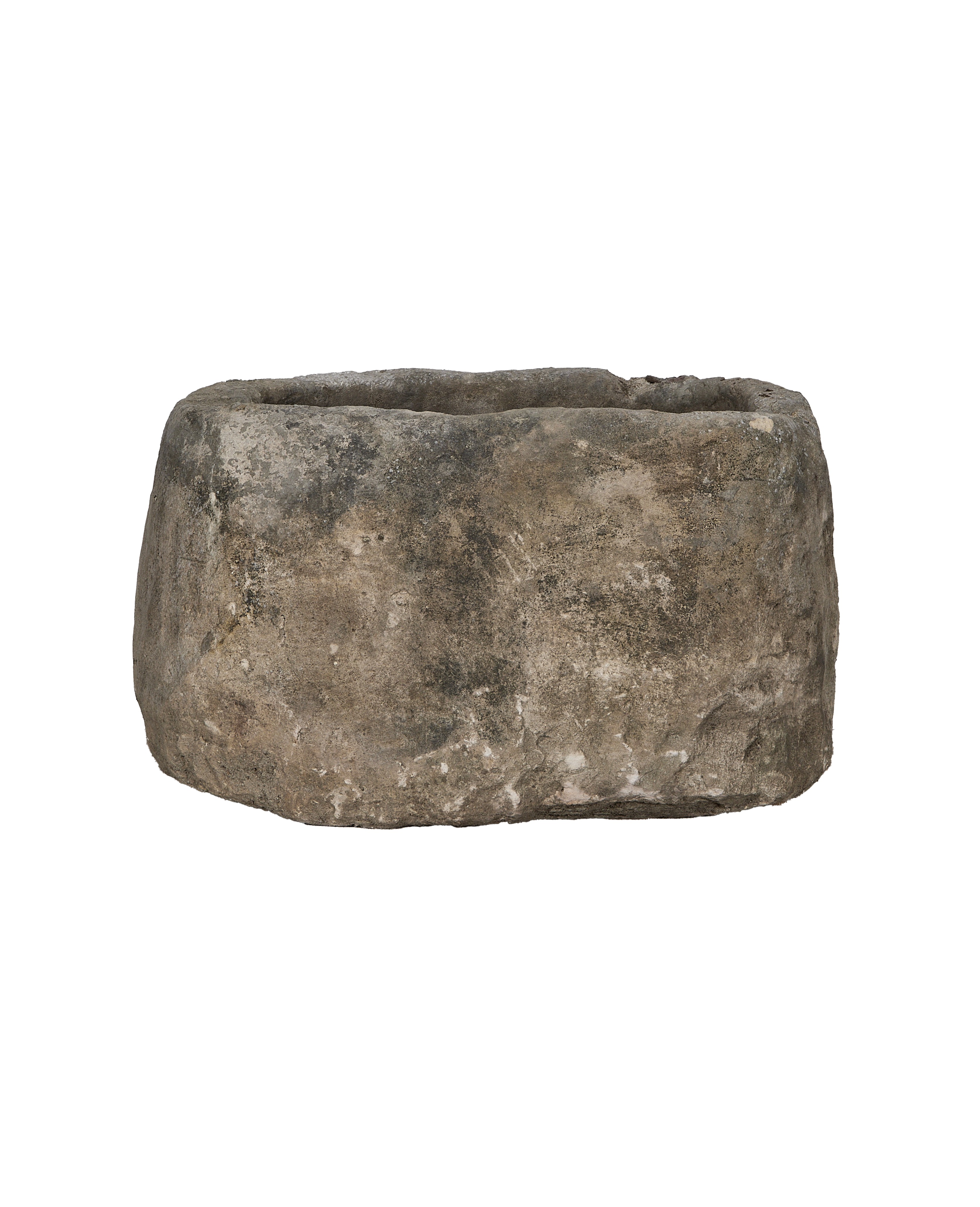 Vintage Indonesian oblong limestone trough, dark weathered texture and rough edges, front view.
