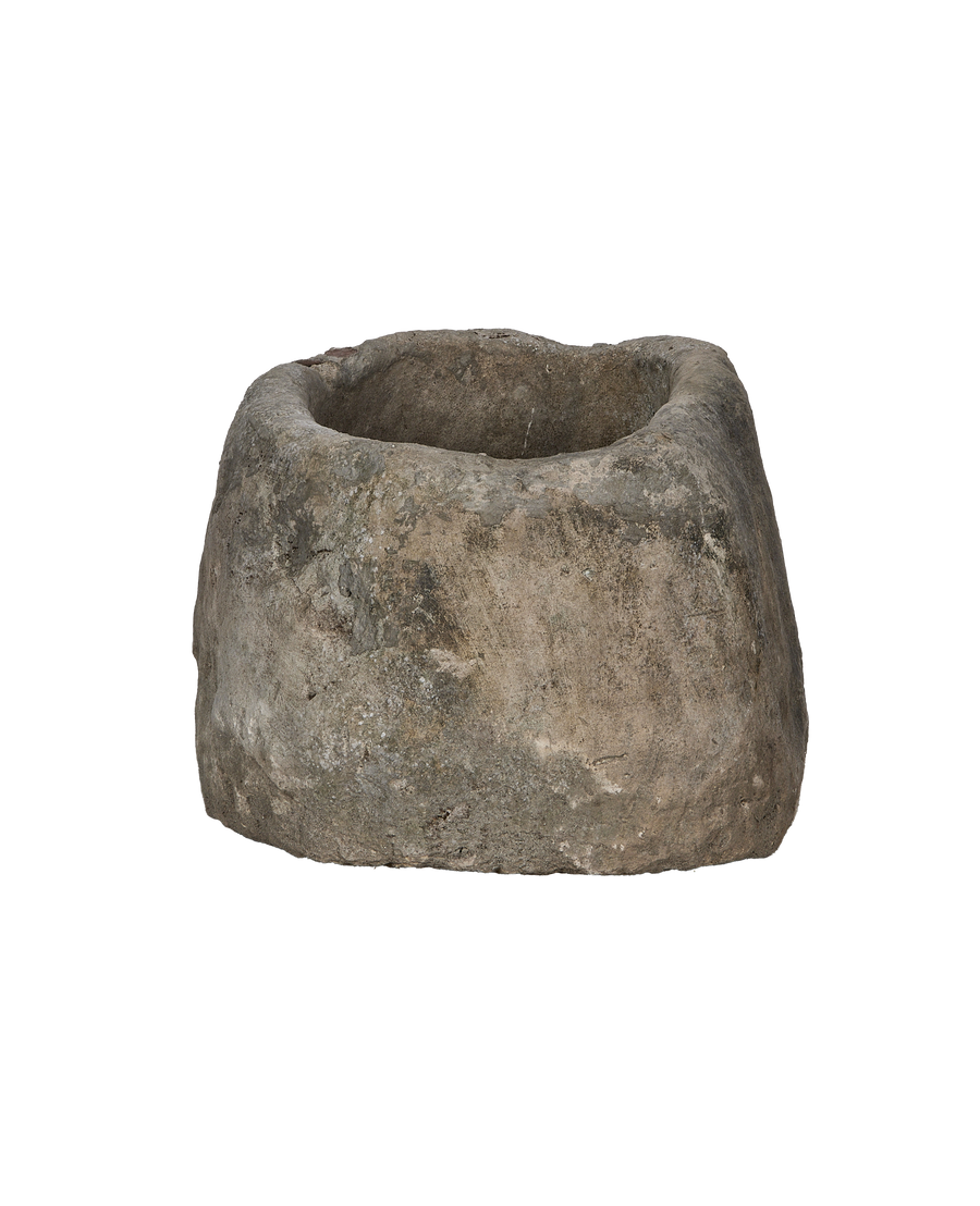 Vintage Indonesian oblong limestone trough, showing weathered texture and interior detail.