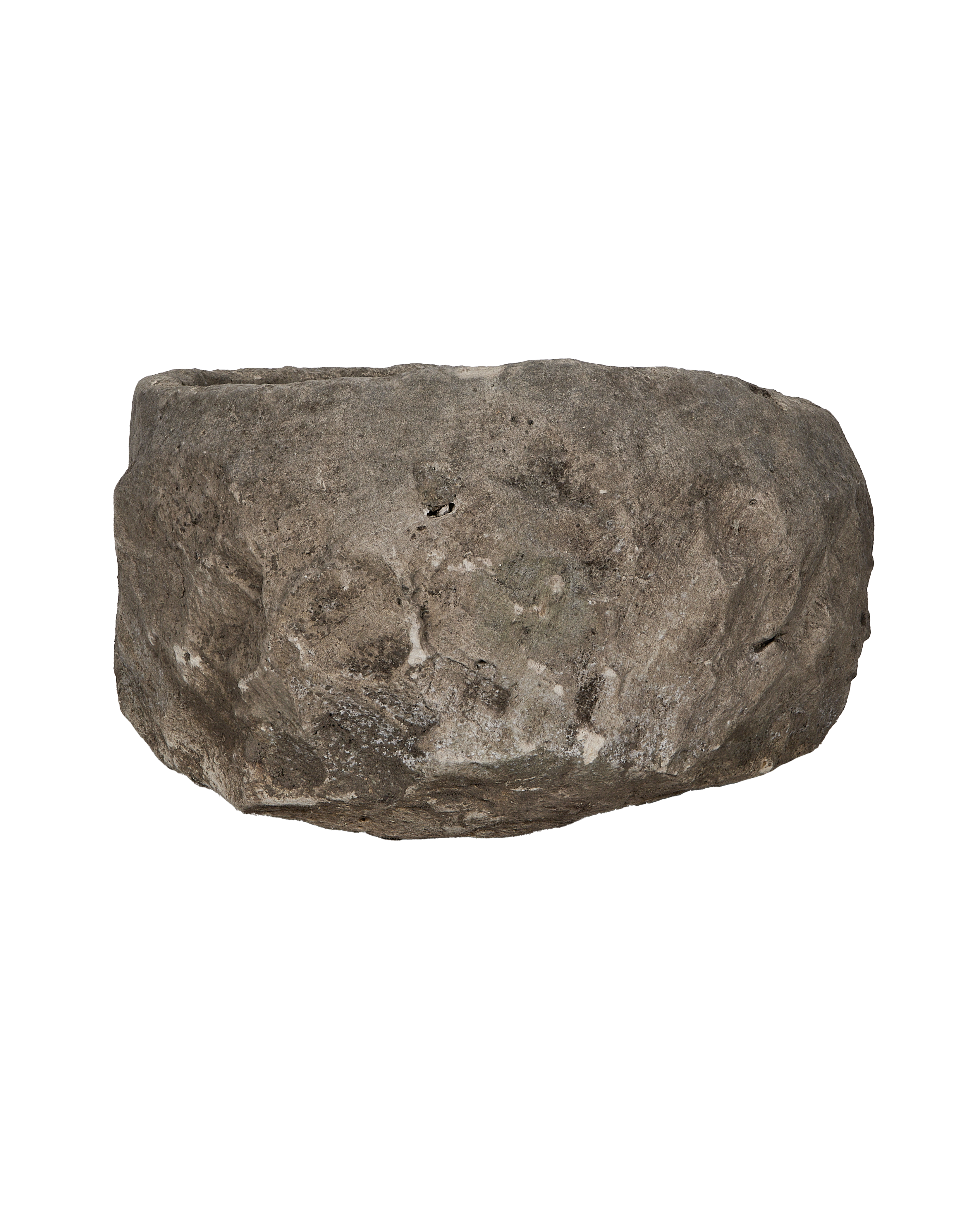 Vintage Indonesian round limestone trough, side profile, revealing natural rough texture and weathered finish.