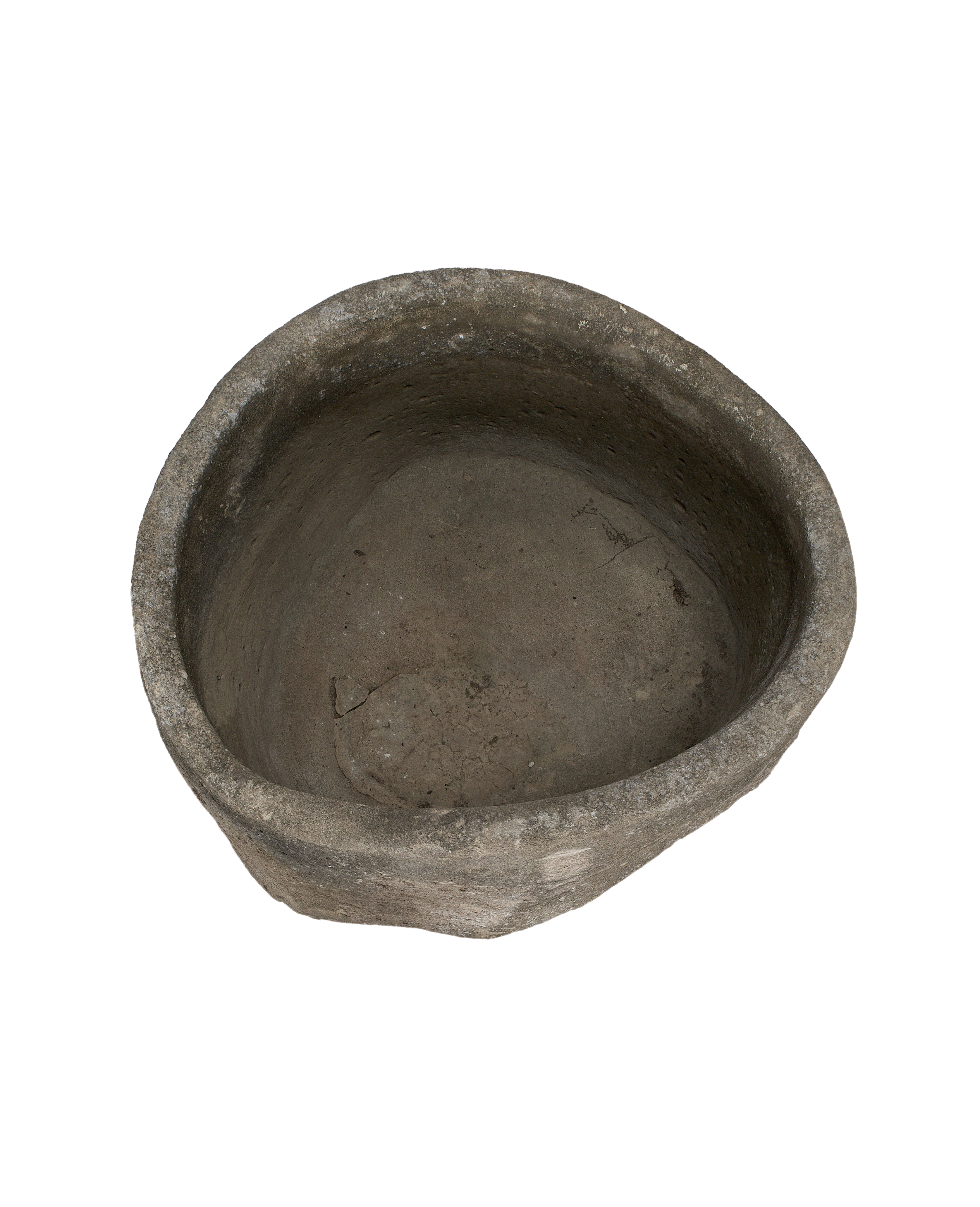 Vintage Indonesian limestone trough, top view of weathered, textured interior.