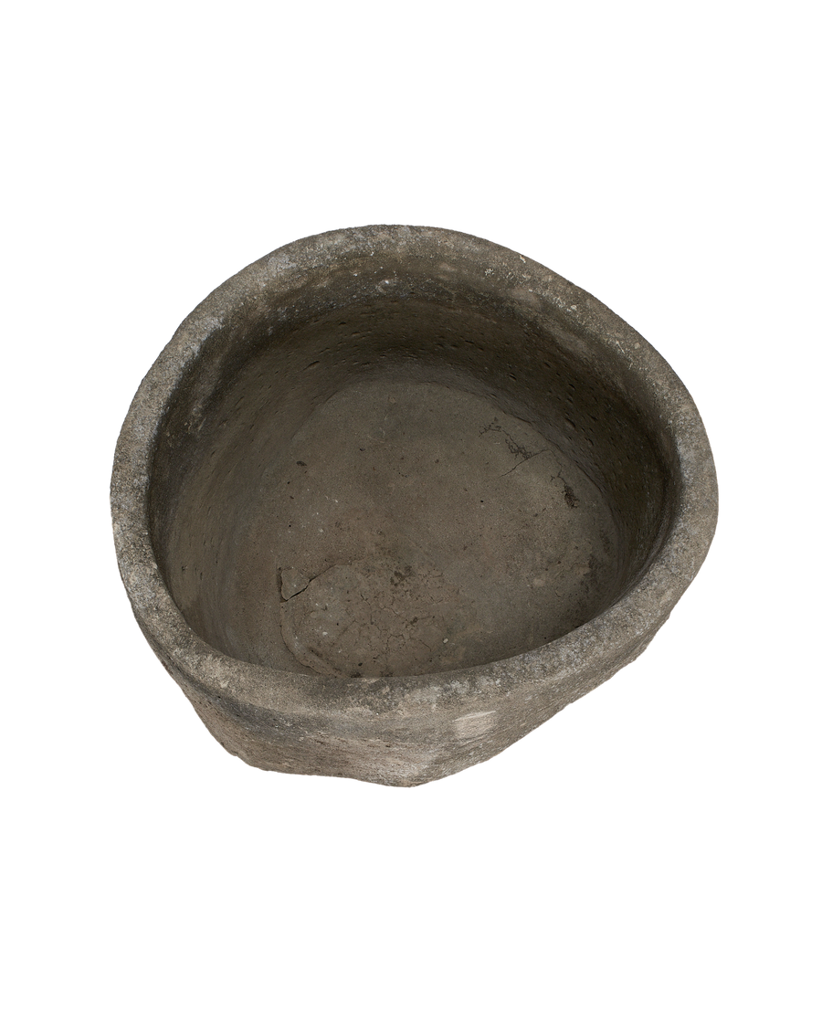 Vintage Indonesian limestone trough, top view of weathered, textured interior.