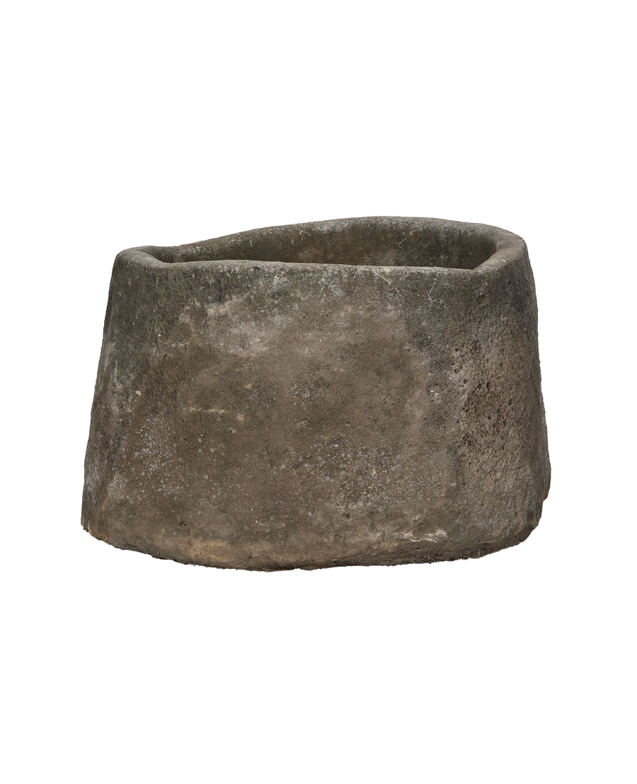 Vintage round limestone trough from Indonesia, showing rough texture and weathered finish.