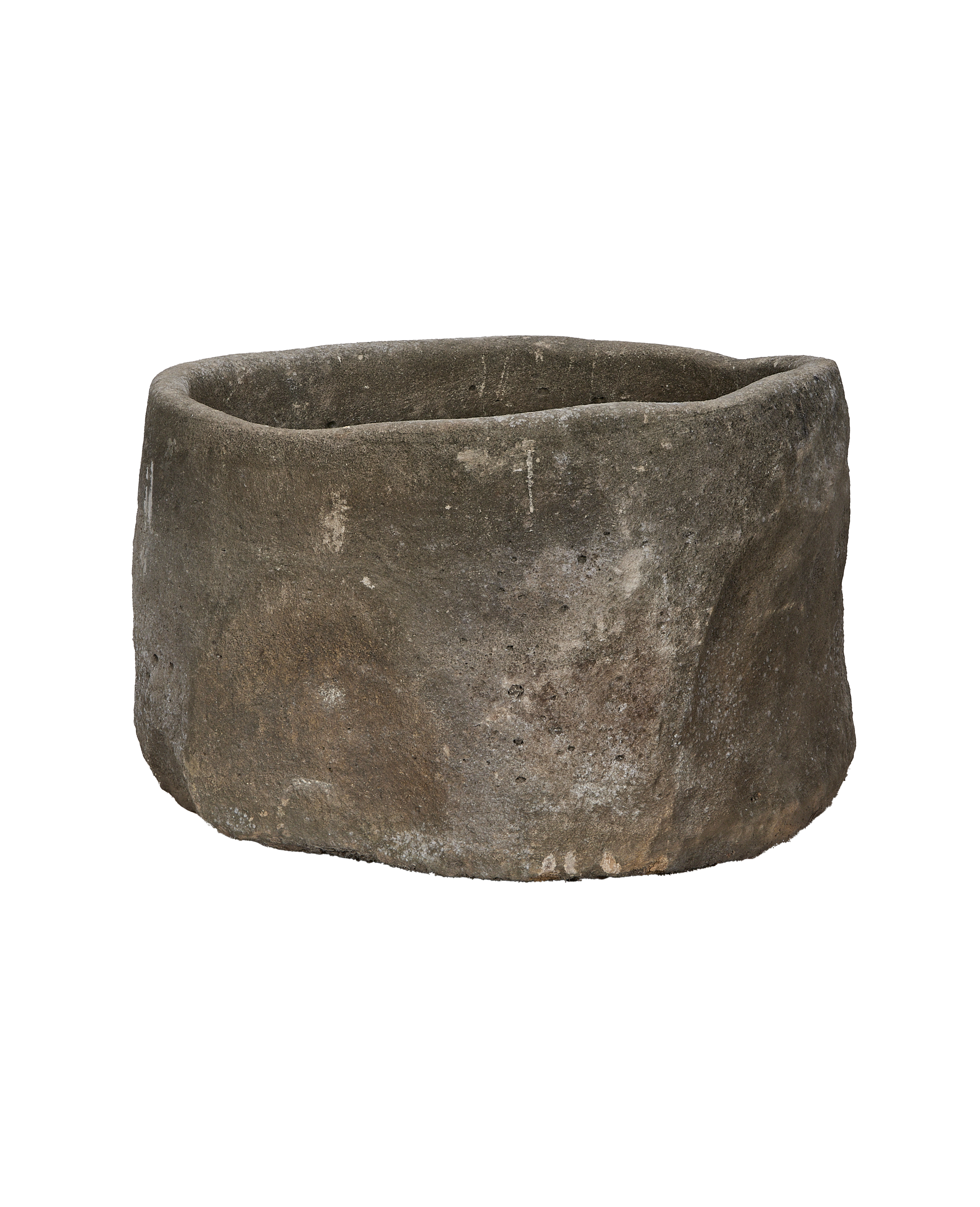 Vintage Indonesian limestone trough, round, rugged texture, showing natural aging and unique imperfections.