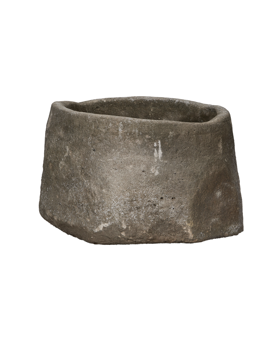Vintage Indonesian limestone trough, round, showing detailed weathered gray surface texture.
