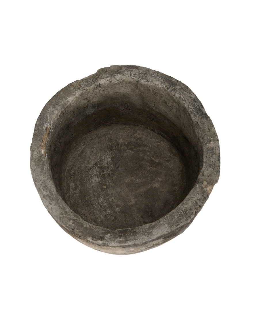 Vintage Indonesian round limestone trough, top-down view showing interior texture and condition.