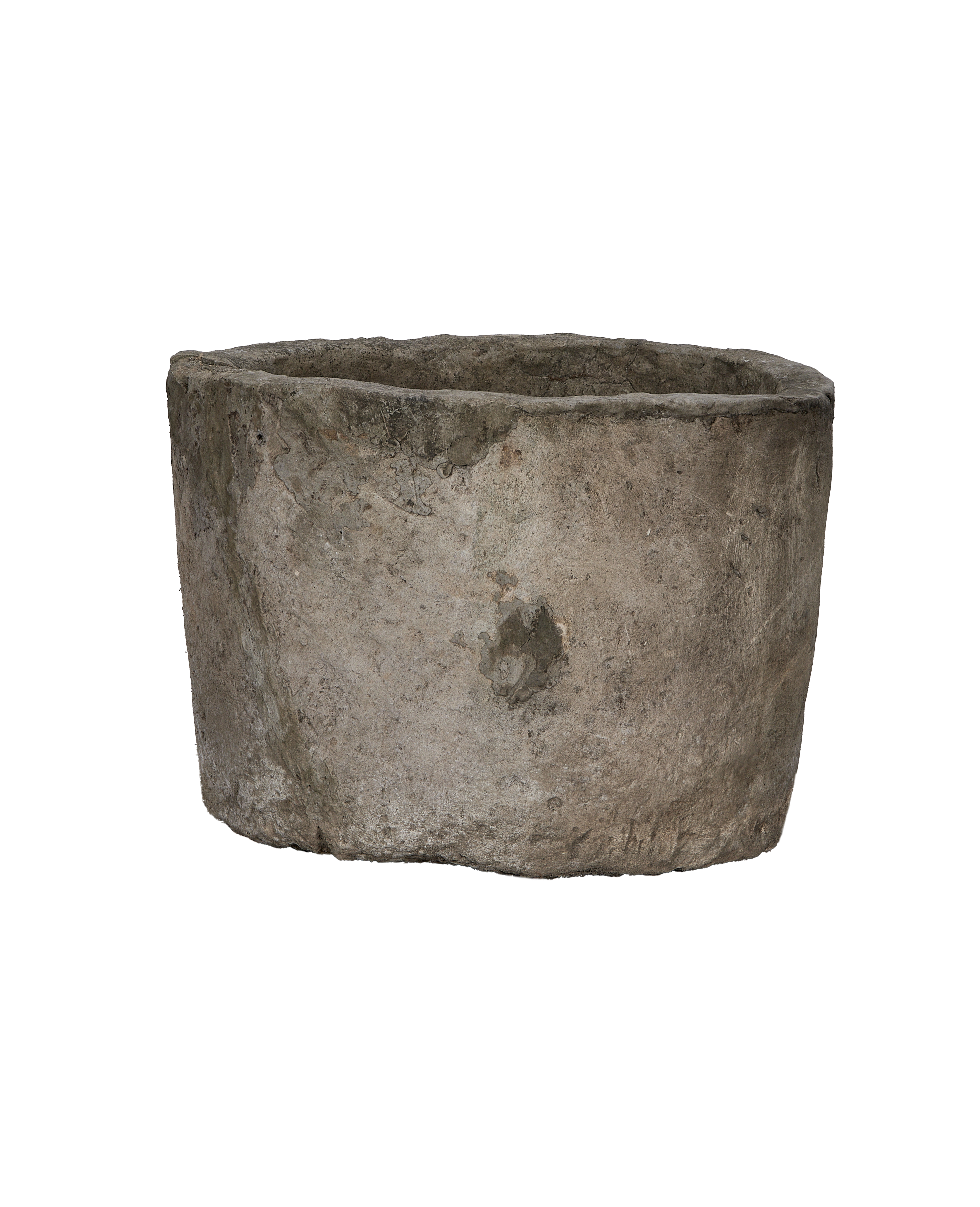 Vintage Indonesian round limestone trough, showing weathered side texture and rough top rim.