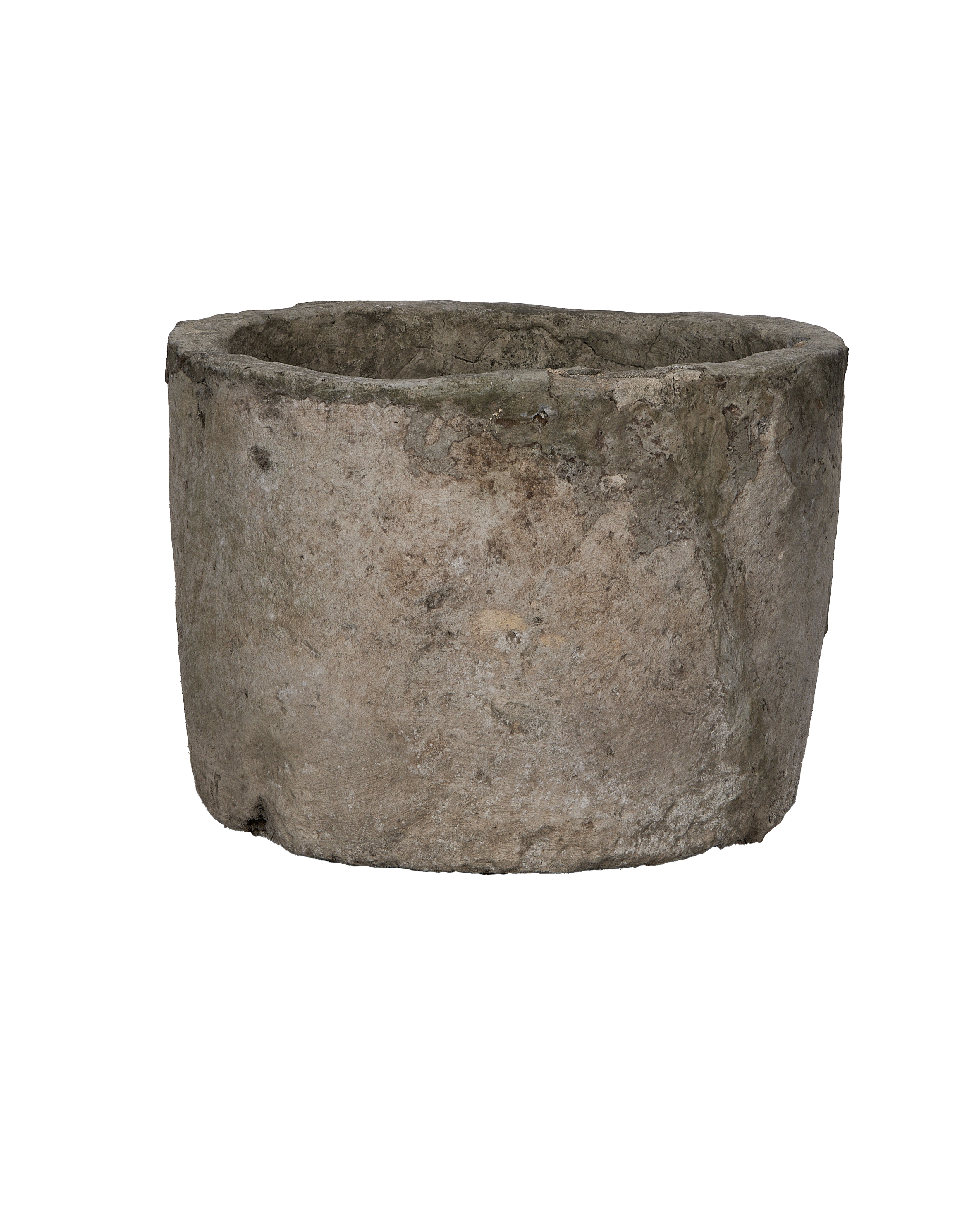 Vintage round limestone trough, showing weathered texture and aged patina on its side.