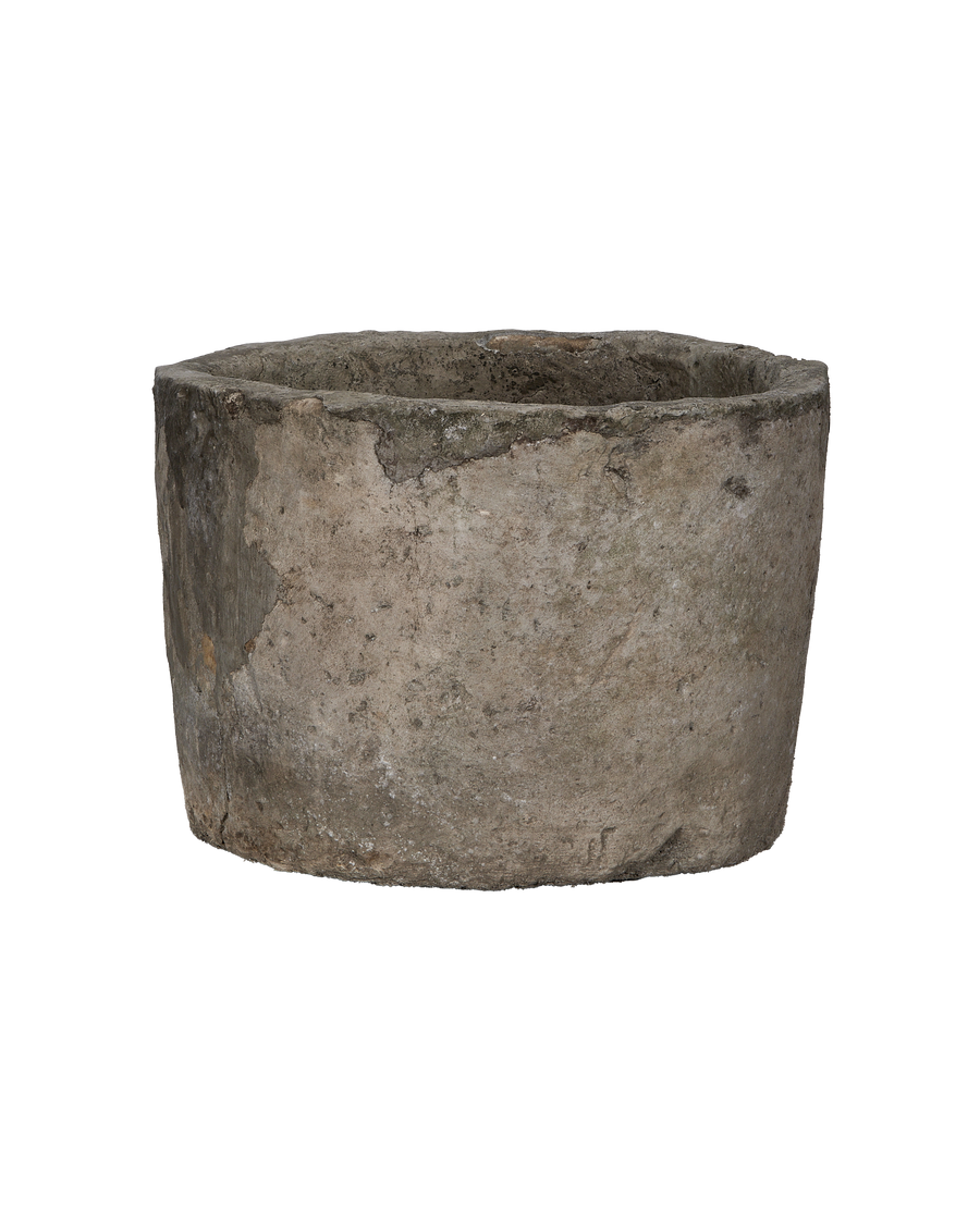 Vintage Indonesian round limestone trough, earthy texture and rustic charm visible.