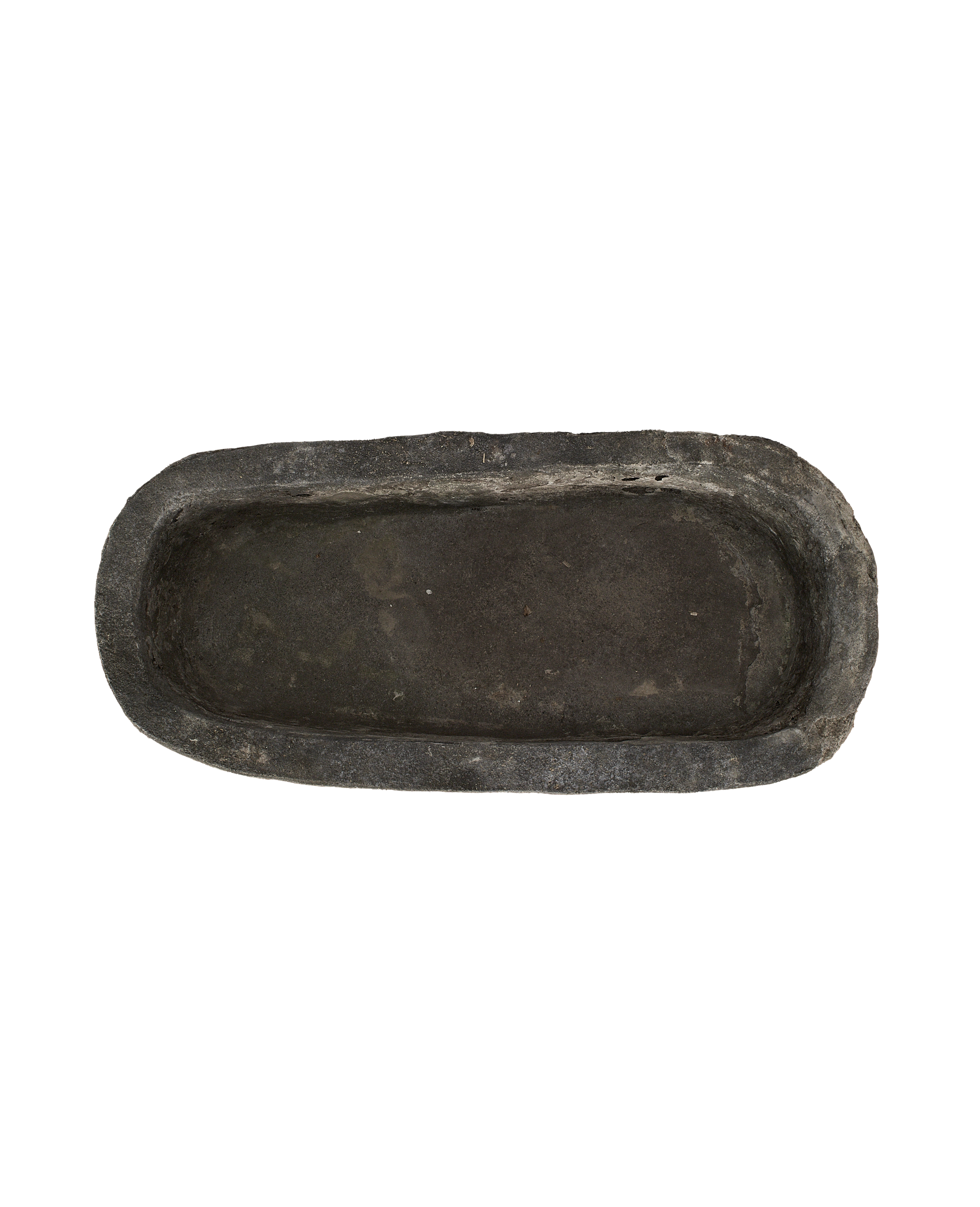 Vintage Indonesian Trough, oblong limestone, dark patina, showing weathered interior surface.