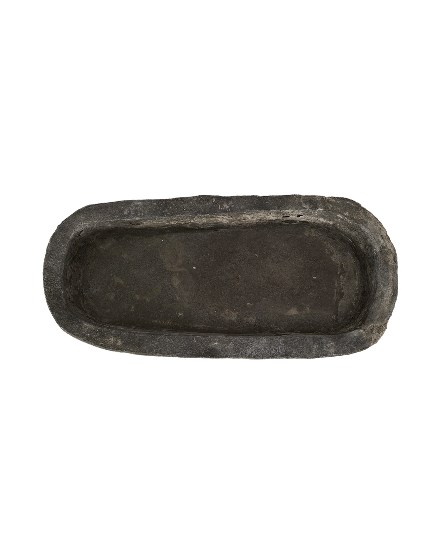 Vintage Indonesian Trough, oblong limestone, dark patina, showing weathered interior surface.