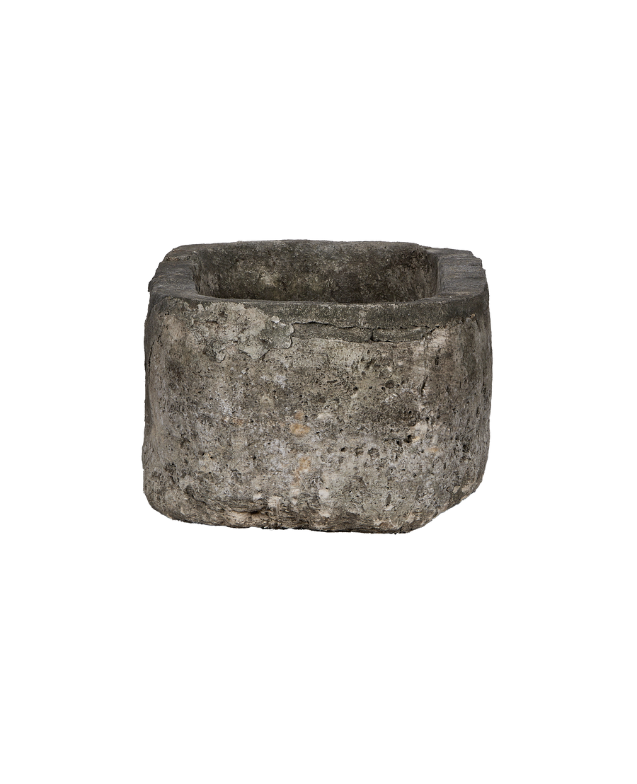 Vintage Indonesian oblong limestone trough, detailed side view showing rustic texture and worn edges.