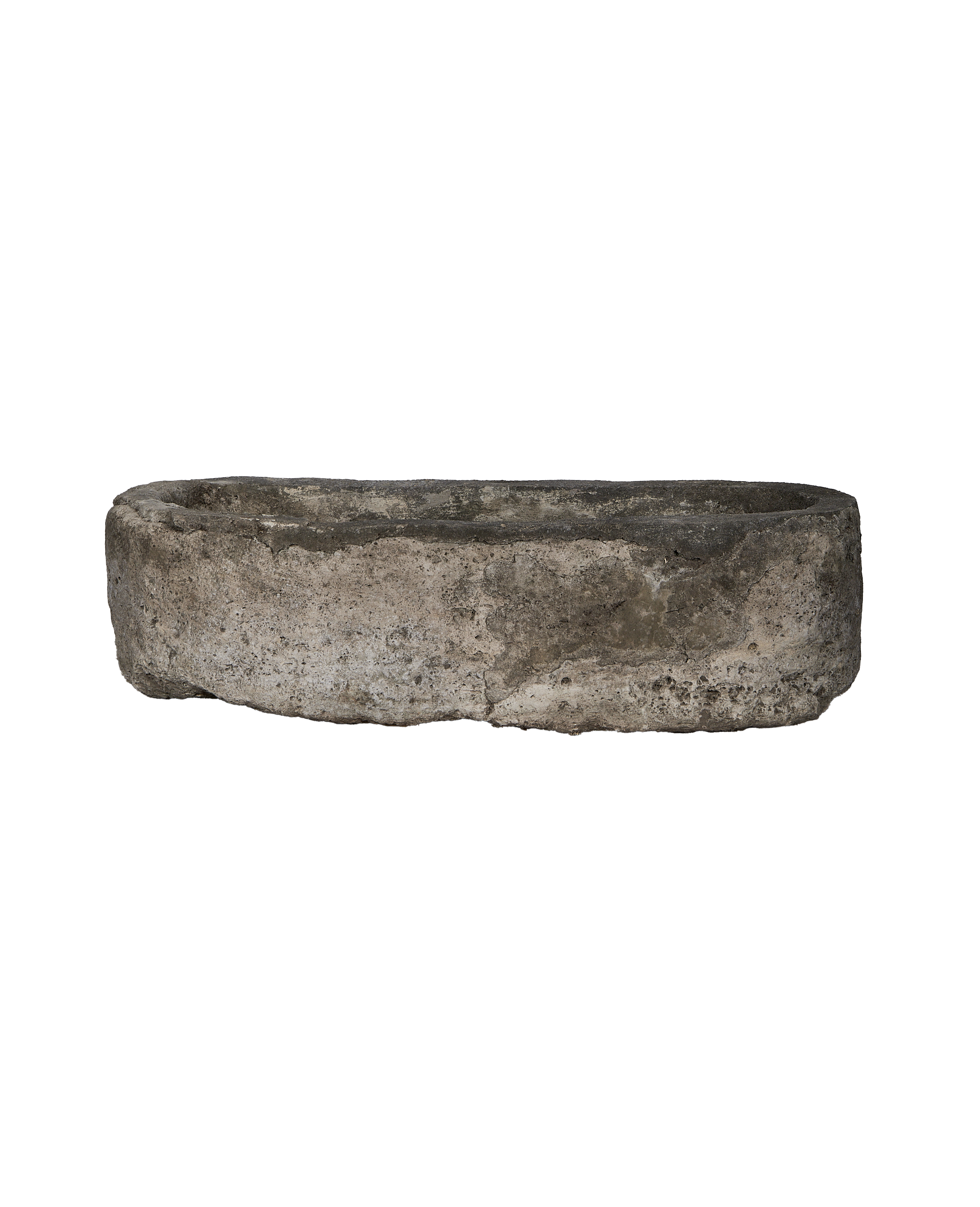 Vintage Indonesian oblong limestone trough, detailed side view, showing weathered surface.