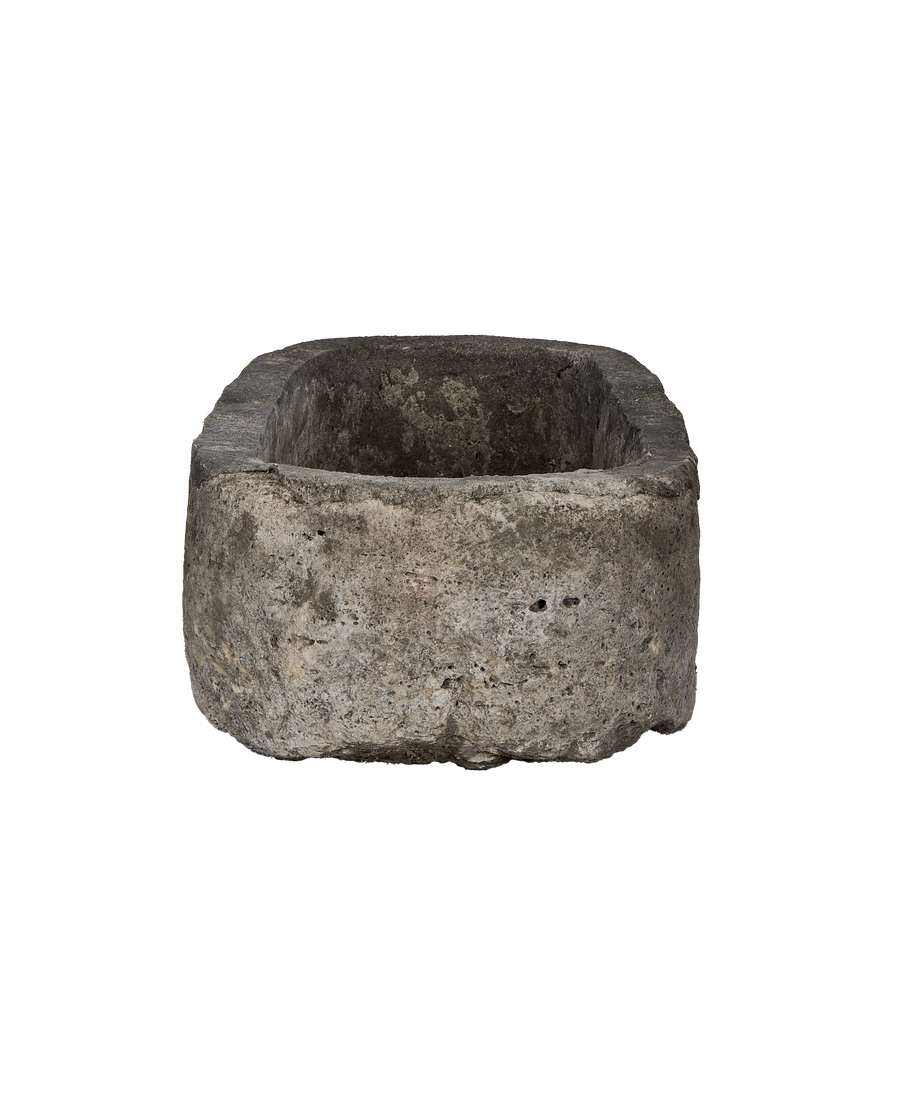 Vintage oblong limestone trough from Indonesia, showing rough exterior texture and sturdy build.