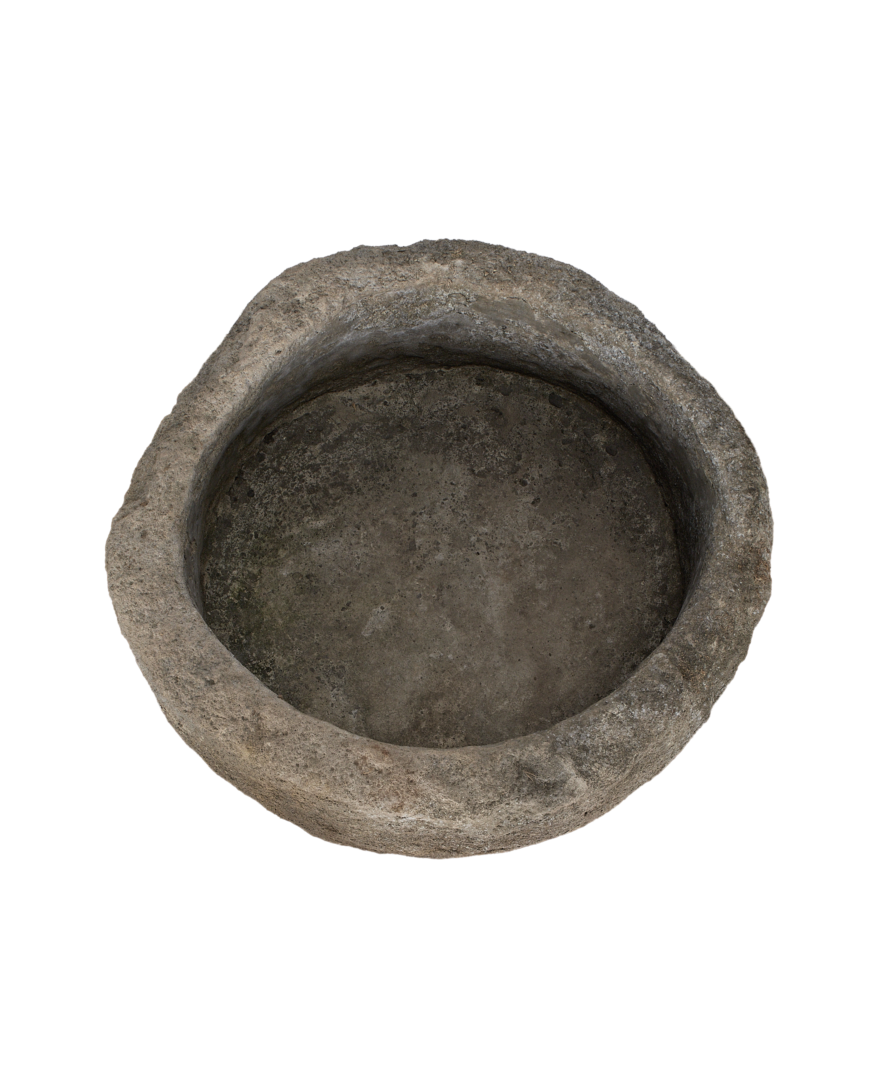 Vintage Indonesian limestone trough, top-down view showing weathered, textured interior and rim.